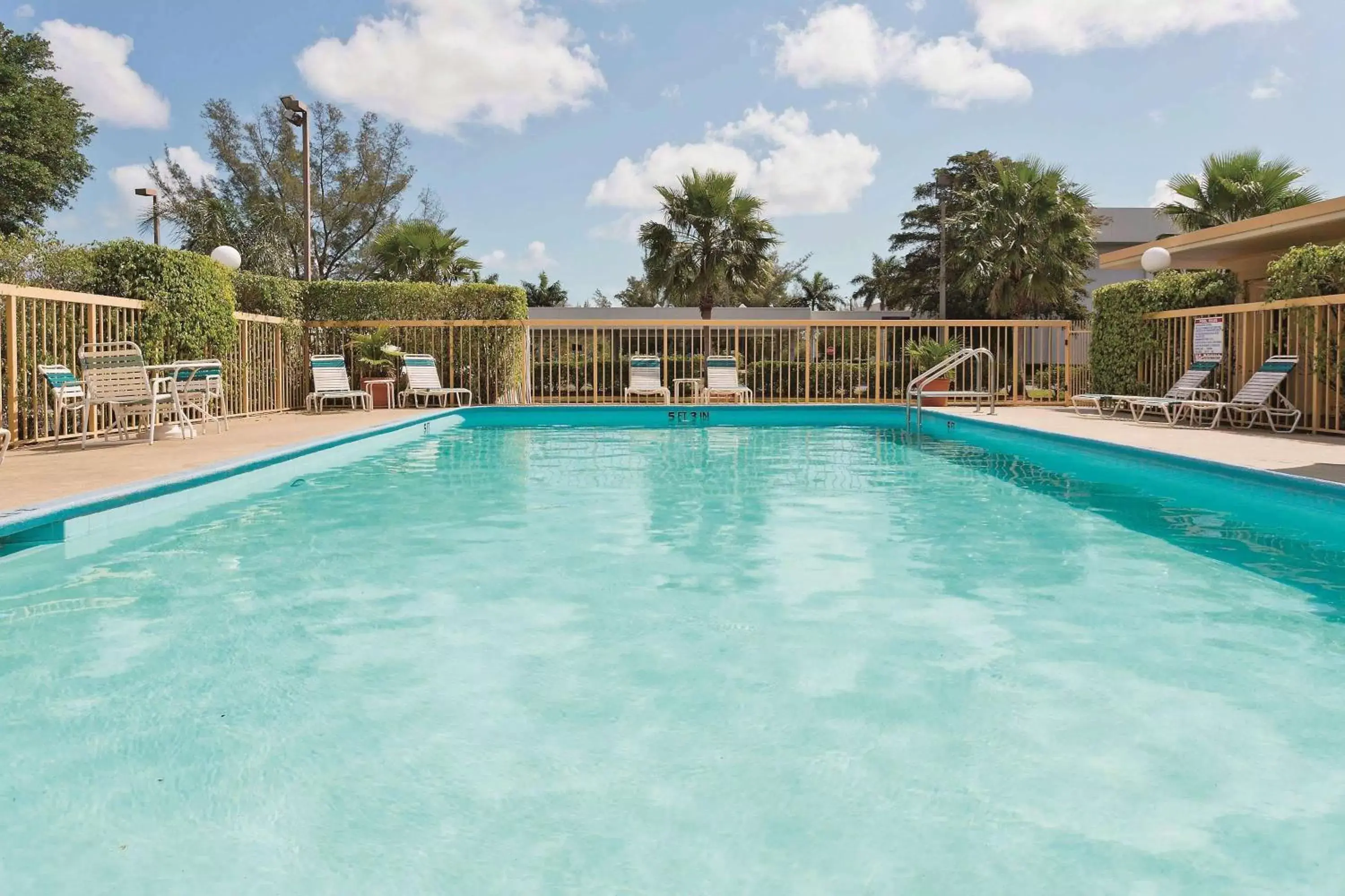 On site, Swimming Pool in La Quinta Inn by Wyndham West Palm Beach - Florida Turnpike