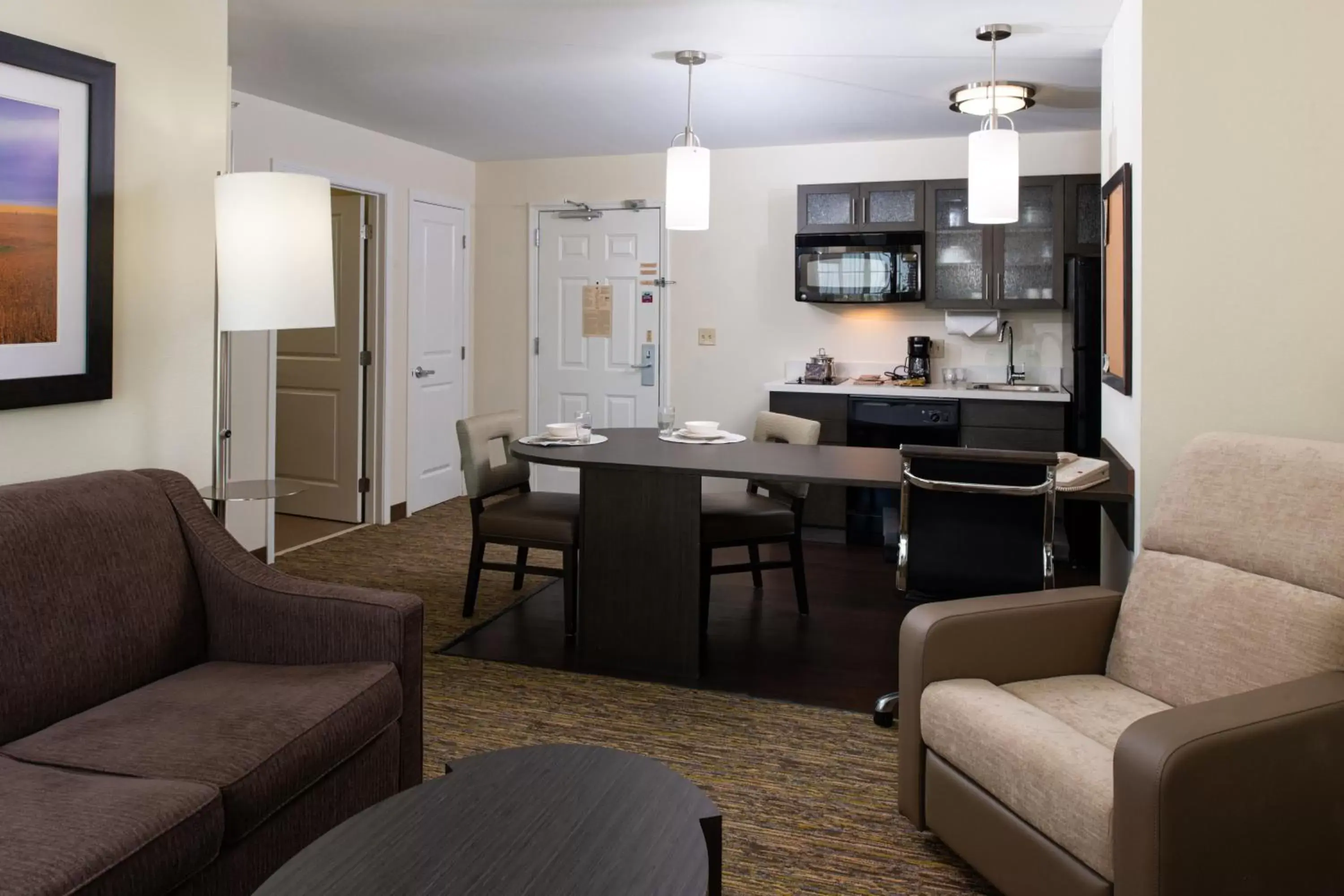 Bedroom, Seating Area in Candlewood Suites Olathe, an IHG Hotel