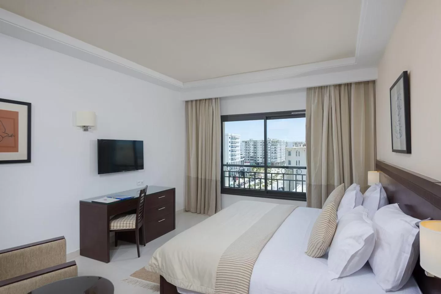 Bed in Le Corail Suites Hotel