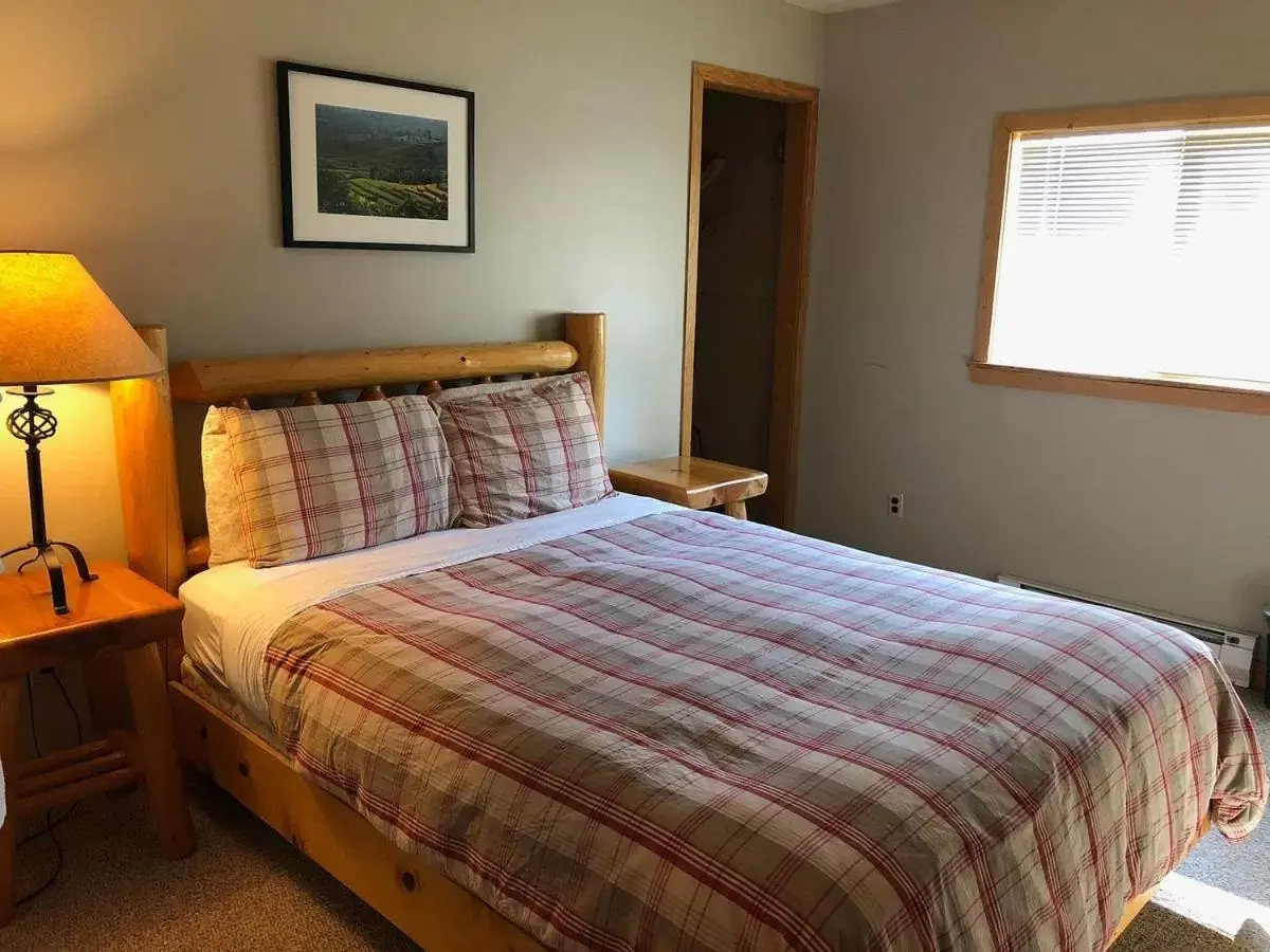 Bed in River Run Inn