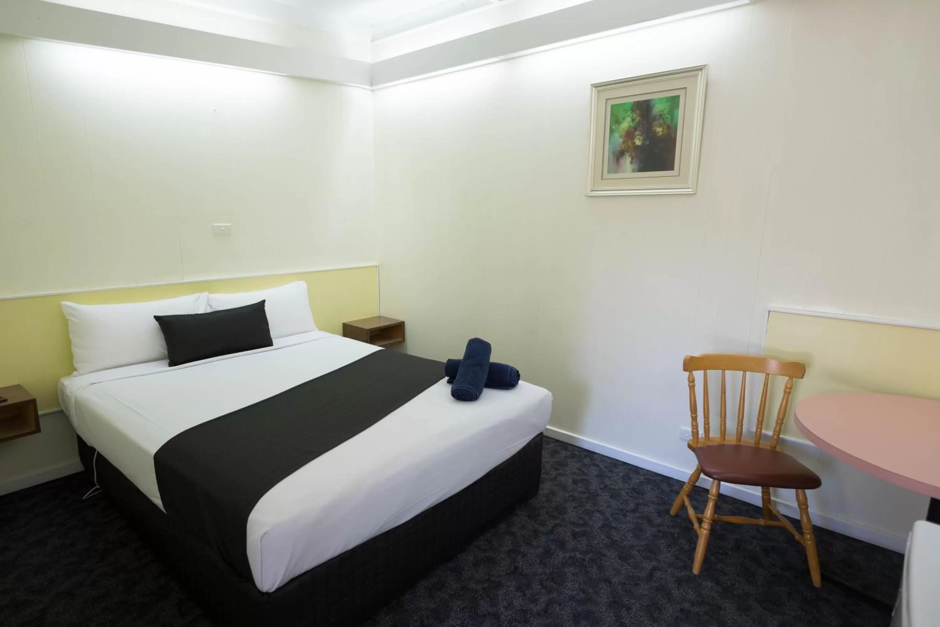 Bed in Pioneer Station Motor Inn