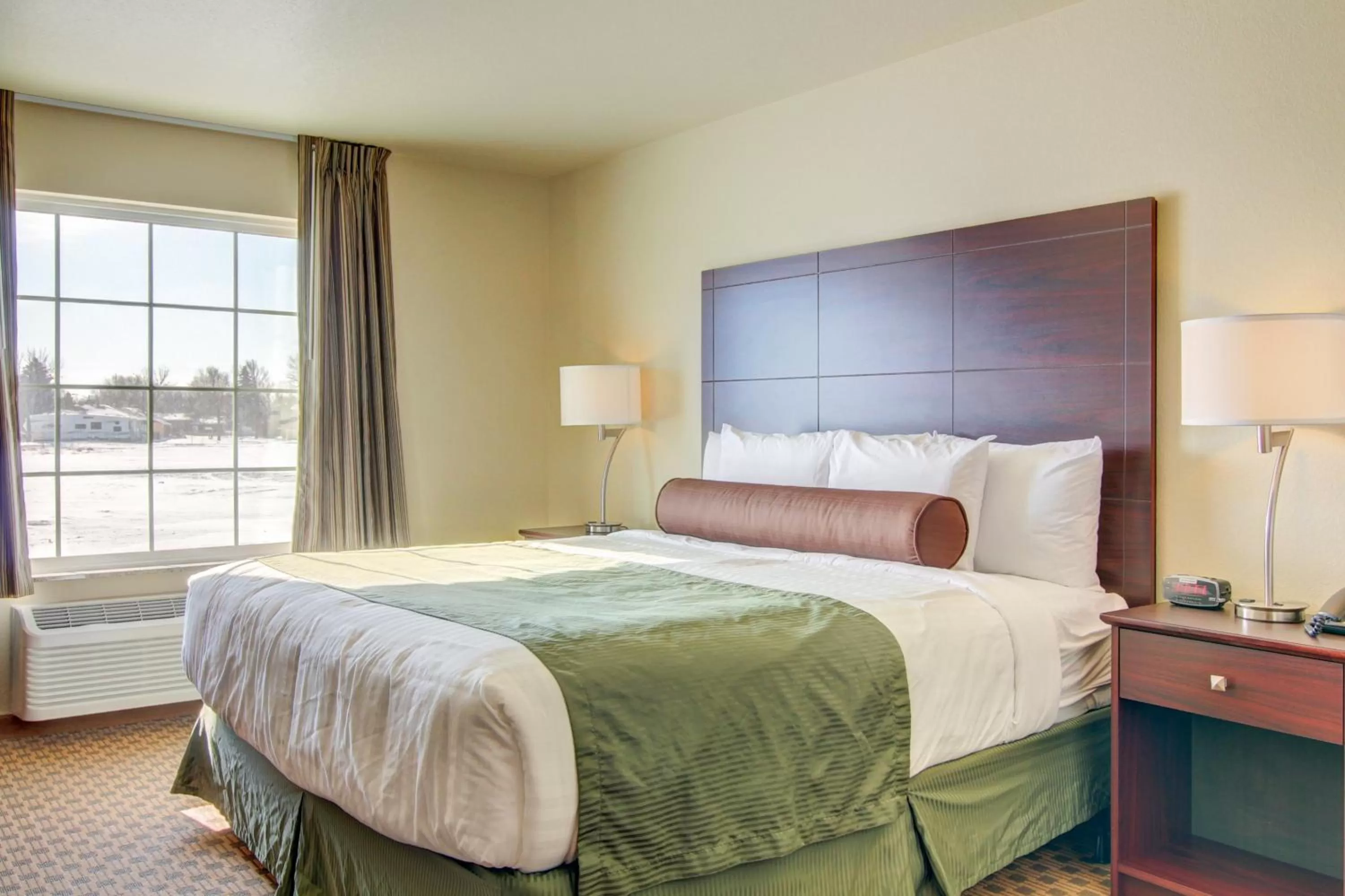 Bed in Cobblestone Inn & Suites Steele