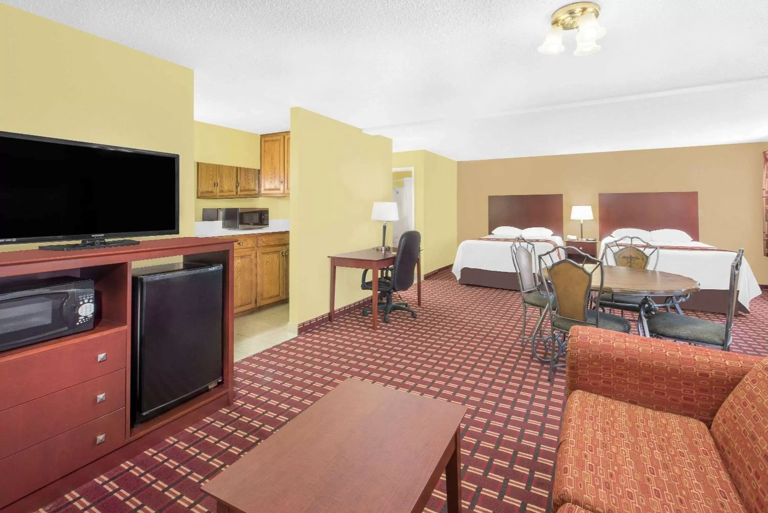 Photo of the whole room, TV/Entertainment Center in Super 8 by Wyndham Kerrville TX