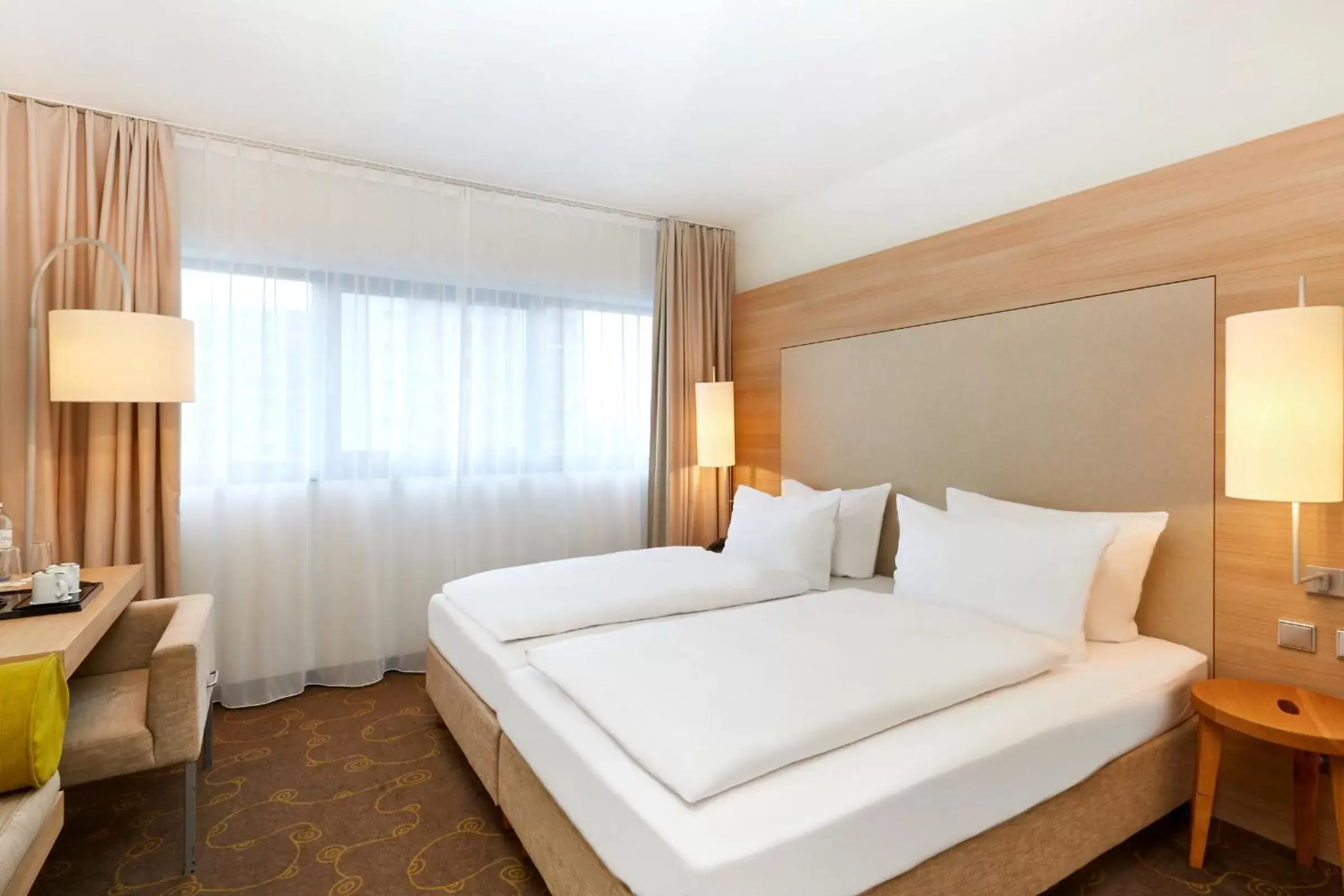 Bedroom, Bed in H+ Hotel Salzburg