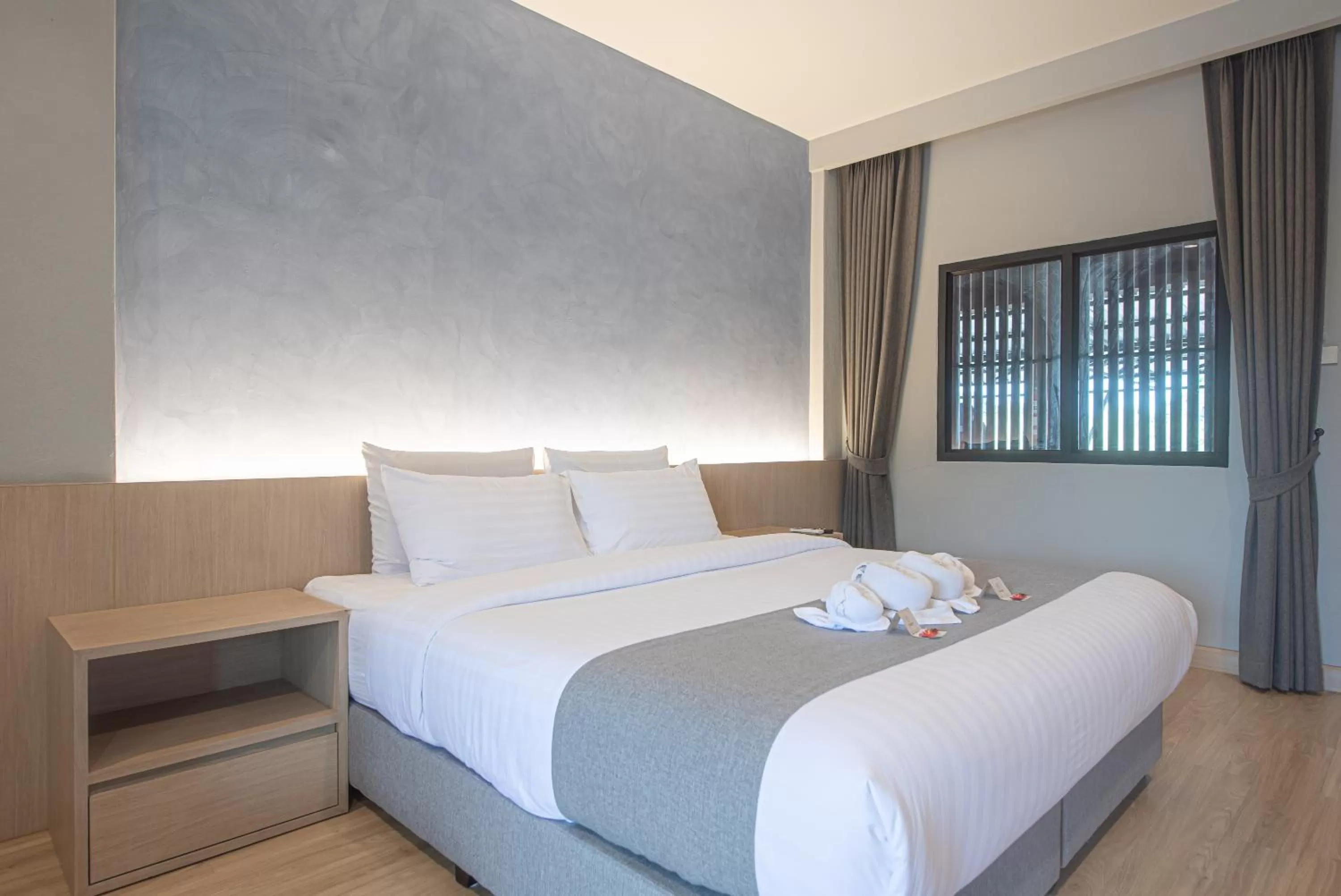 Bed in Tarnsiri Boutique Resort