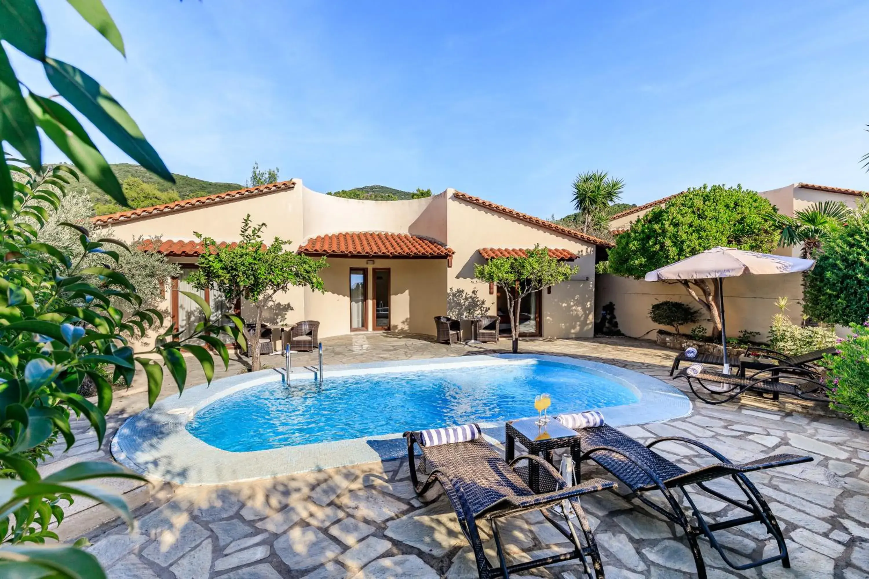 Bungalow Sharing Pool in Skopelos Holidays Hotel & Spa Bungalow Sharing Pool in Skopelos Holidays Hotel & Spa