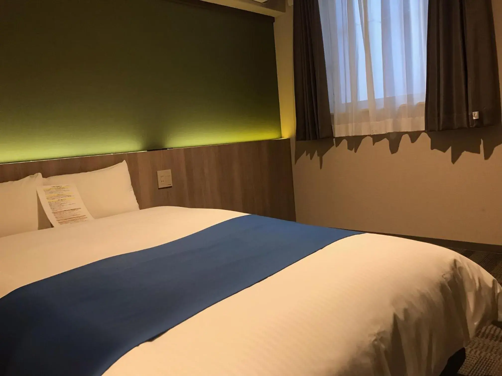Bed in Hotel Lantana Naha Matsuyama