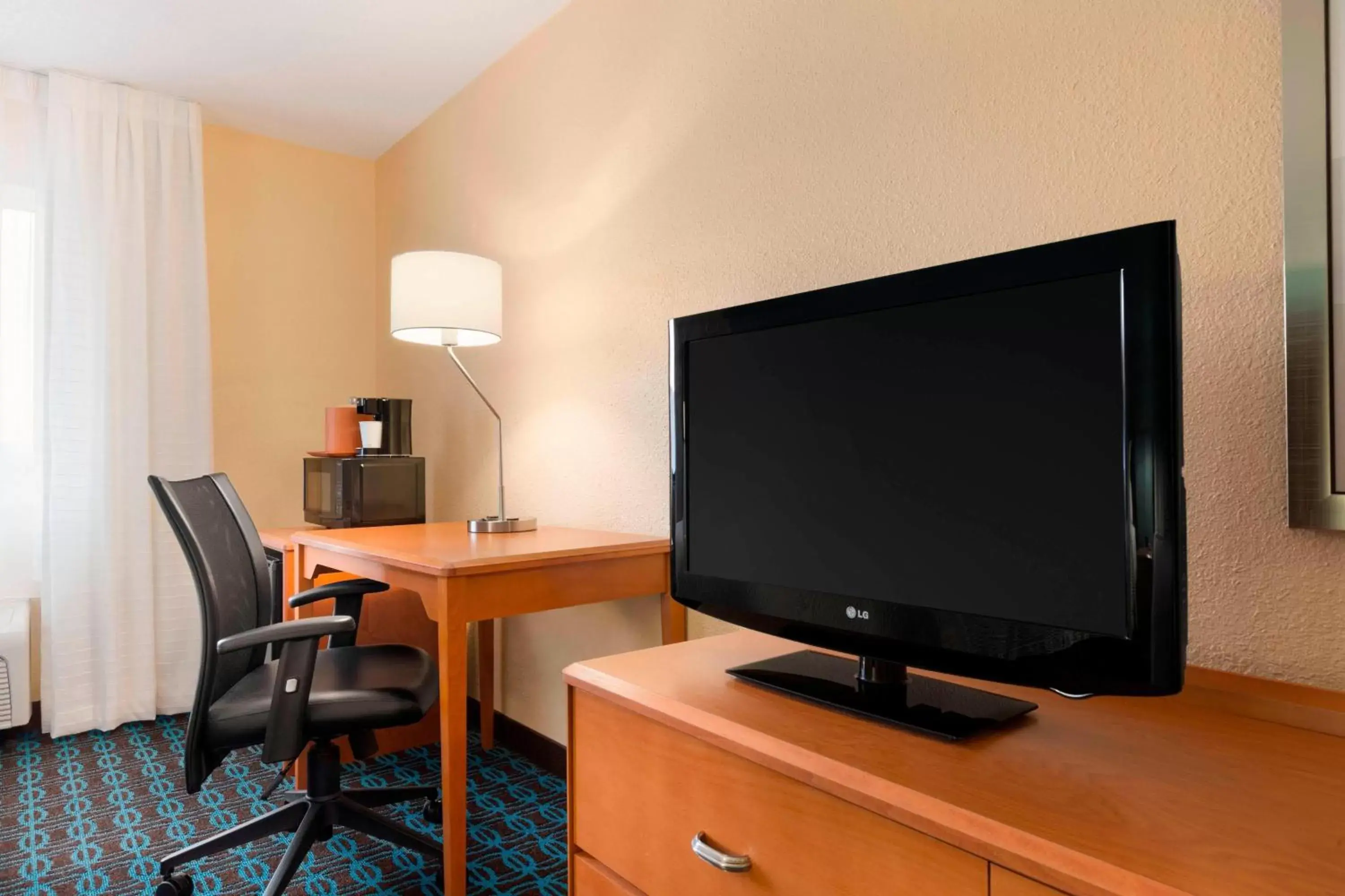 Photo of the whole room, TV/Entertainment Center in Fairfield Inn & Suites Saginaw