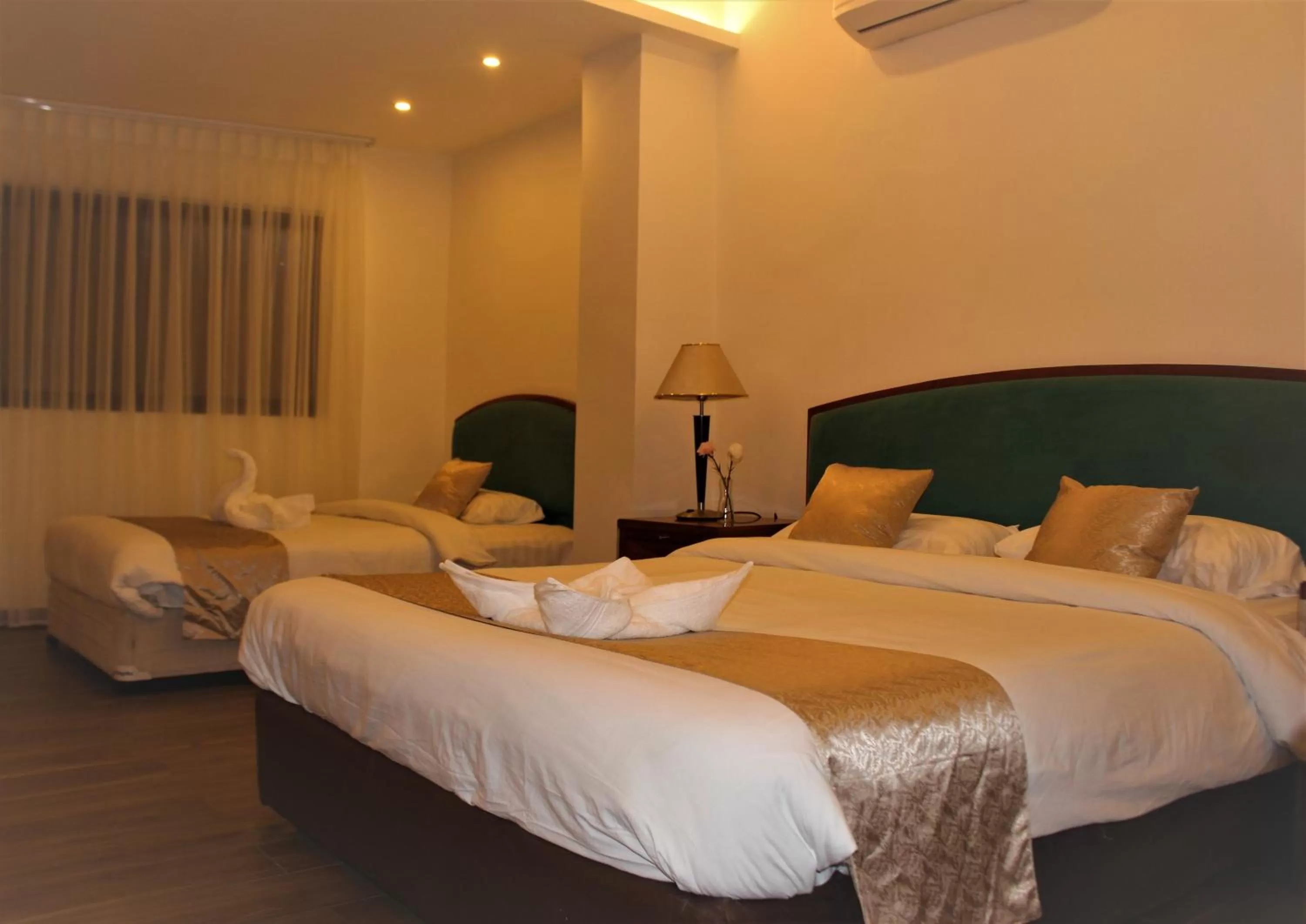 Bed in New MerryLand Hotel