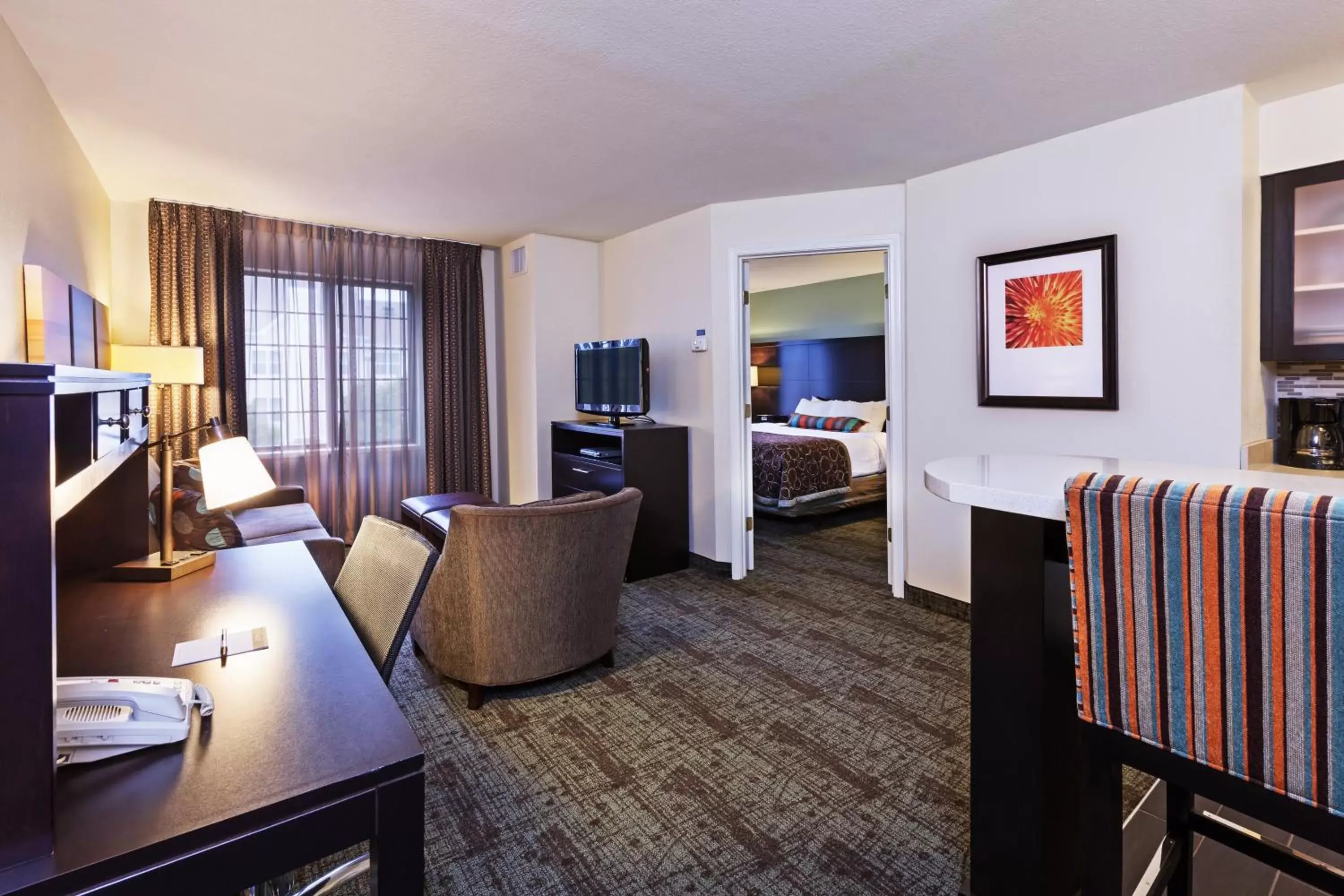 Photo of the whole room, Seating Area in Staybridge Suites Tulsa-Woodland Hills, an IHG Hotel