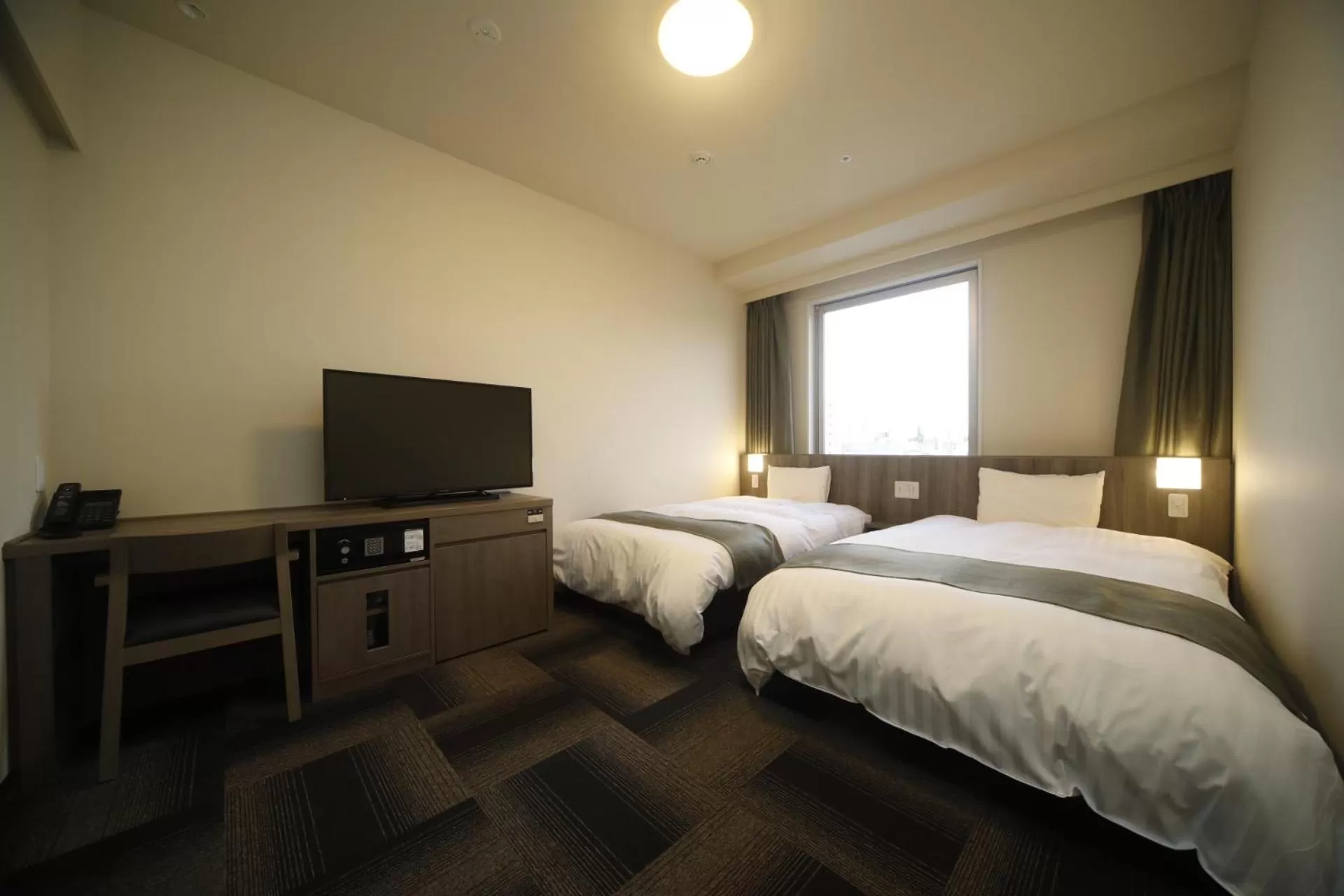 Bed in Dormy Inn Korakuen