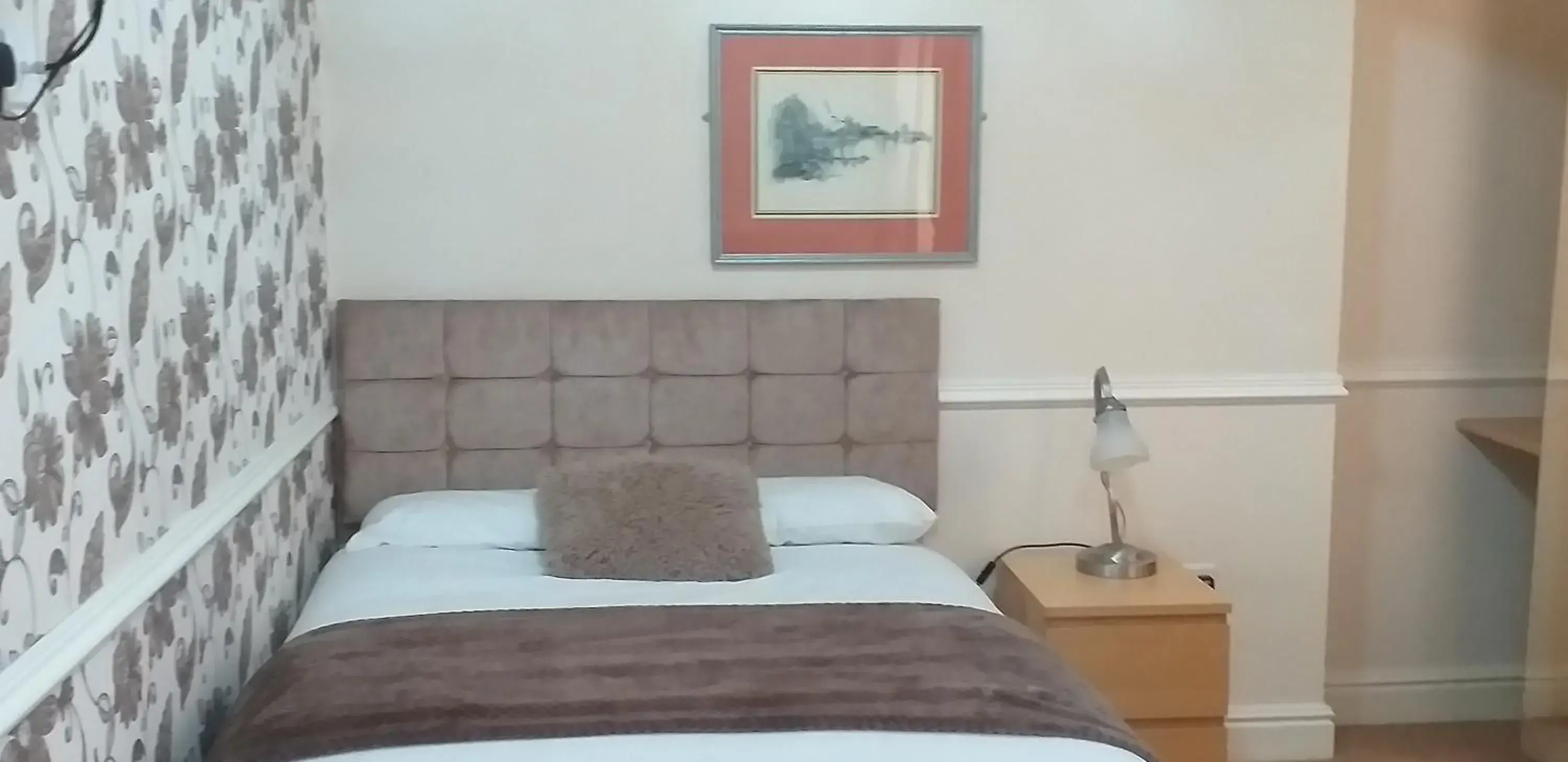 Bed in Surrey House Hotel