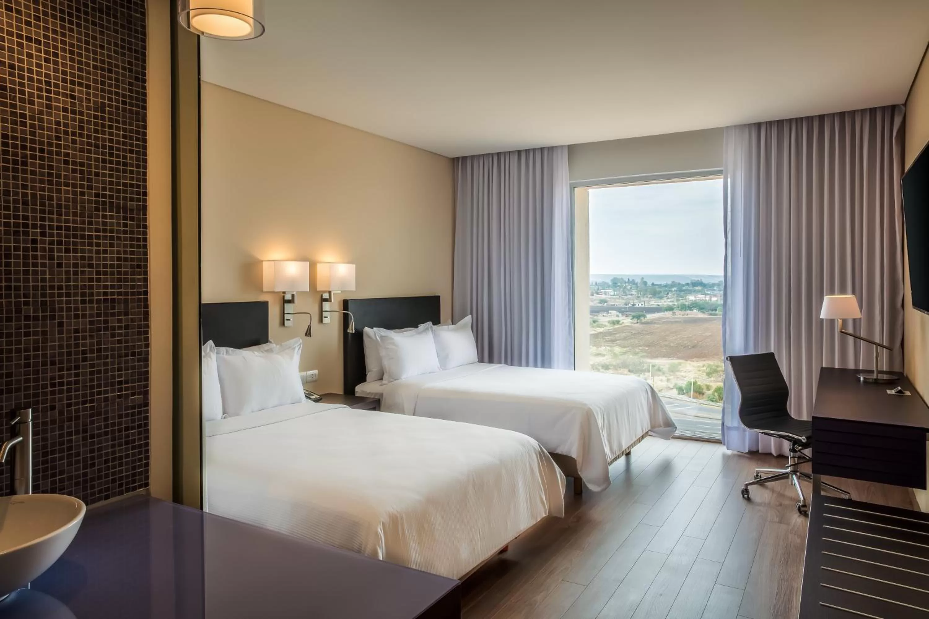 Photo of the whole room, Bed in Fiesta Inn Silao Puerto Interior