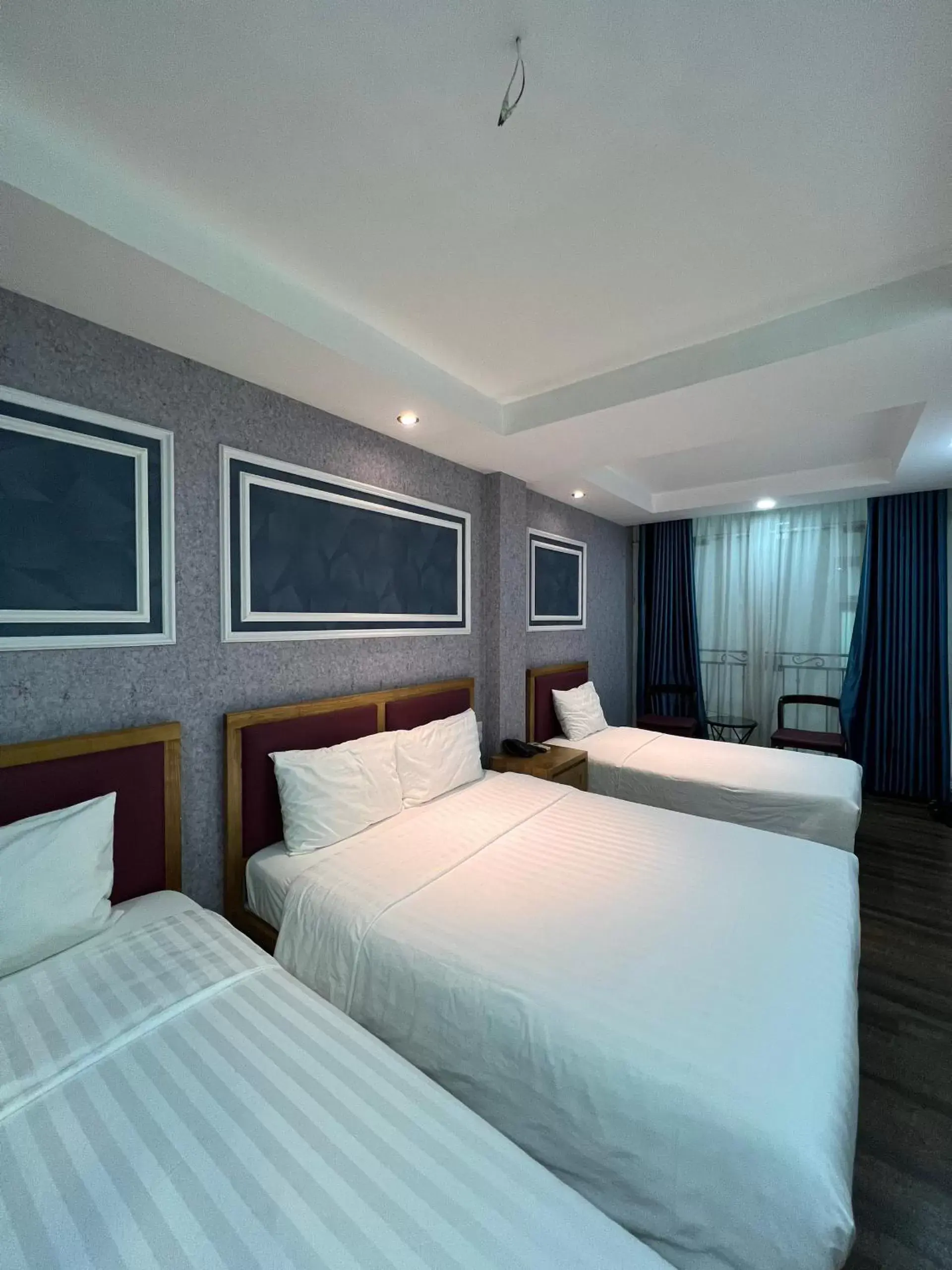Bed in Holiday Suites Hotel & Spa