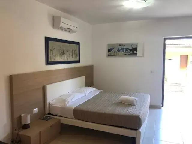 Bed in San Michele Apartments&Rooms