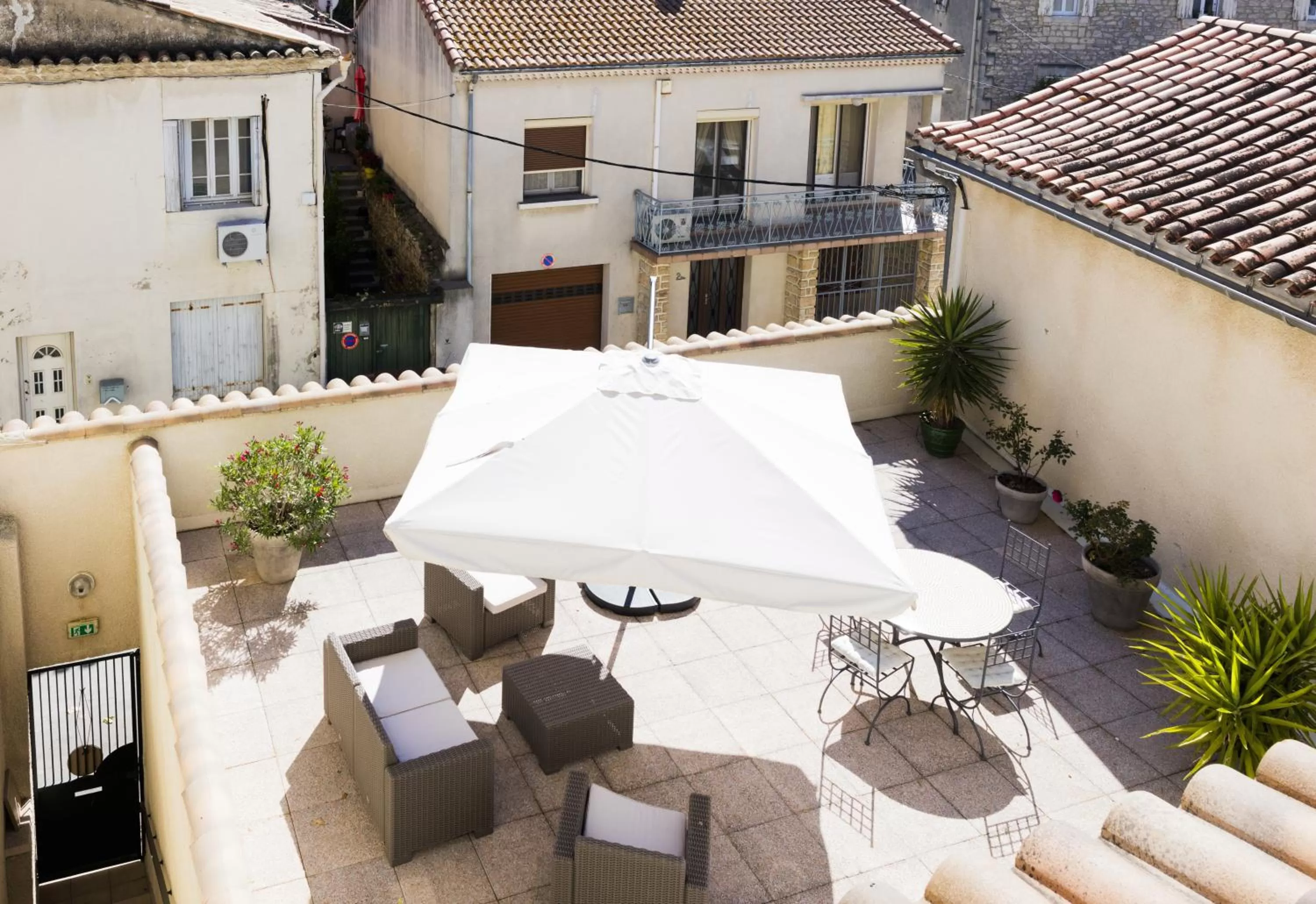 Garden view in Logis Hôtel Restaurant Le Cours