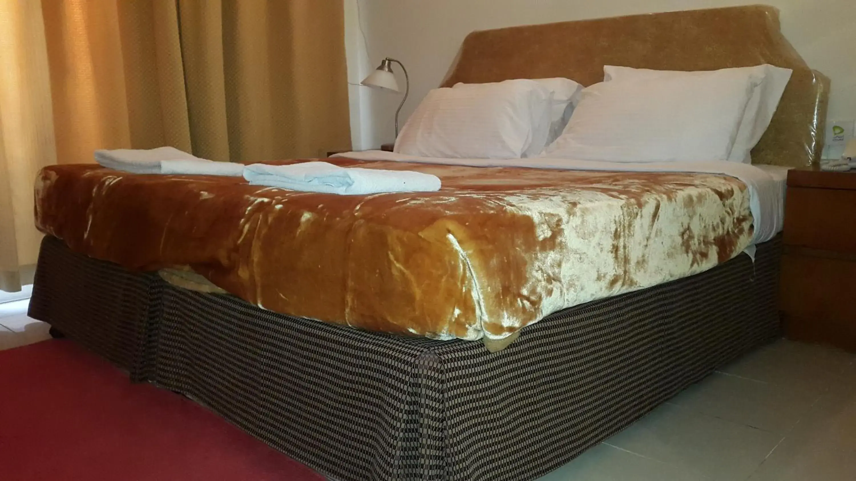 Decorative detail, Bed in AL Raien Hotel Apartment