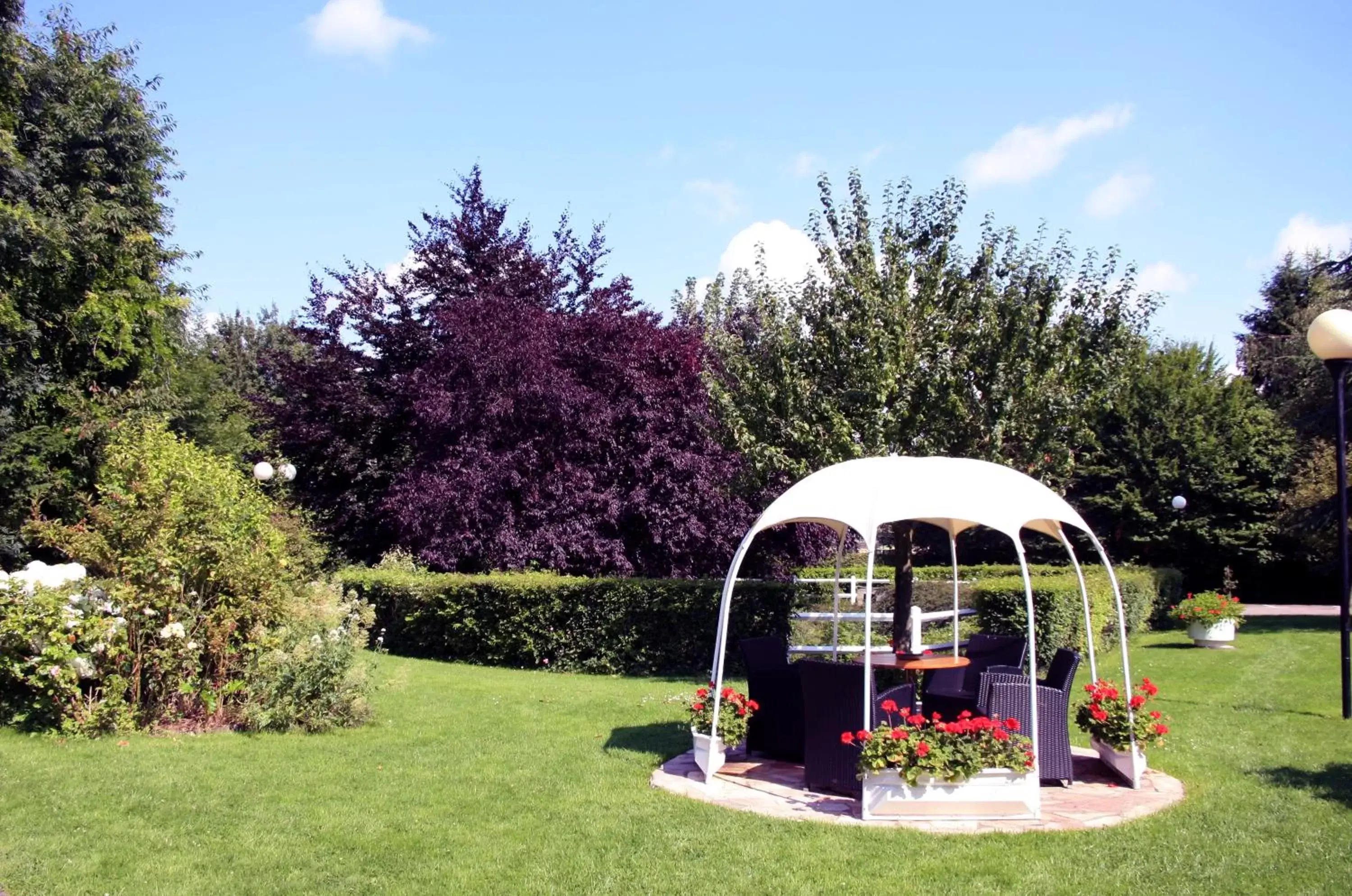 Garden view in La Berteliere, The Originals Relais (Qualys-Hotel)