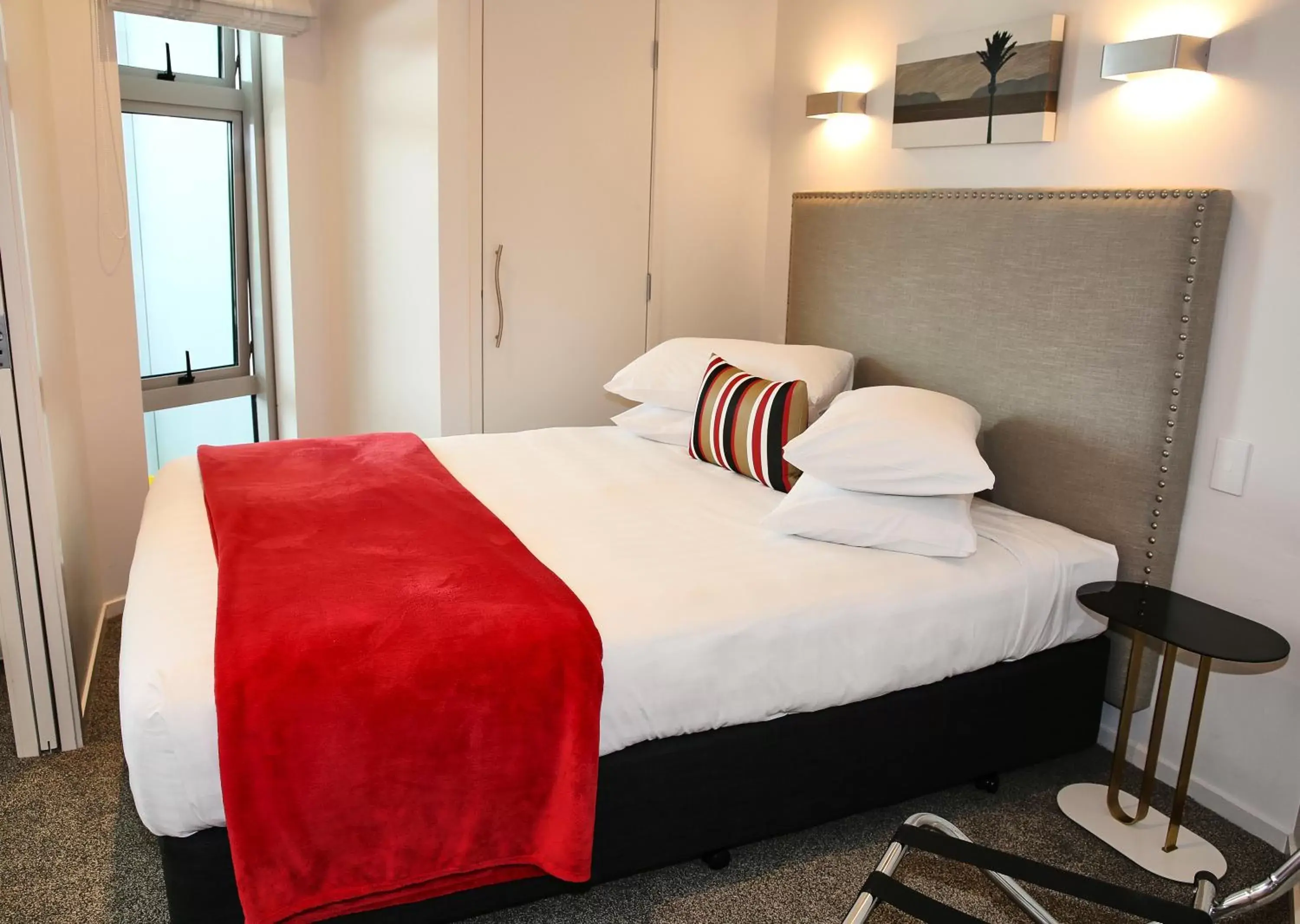 Bed in Ramada Suites by Wyndham Nautilus Orewa