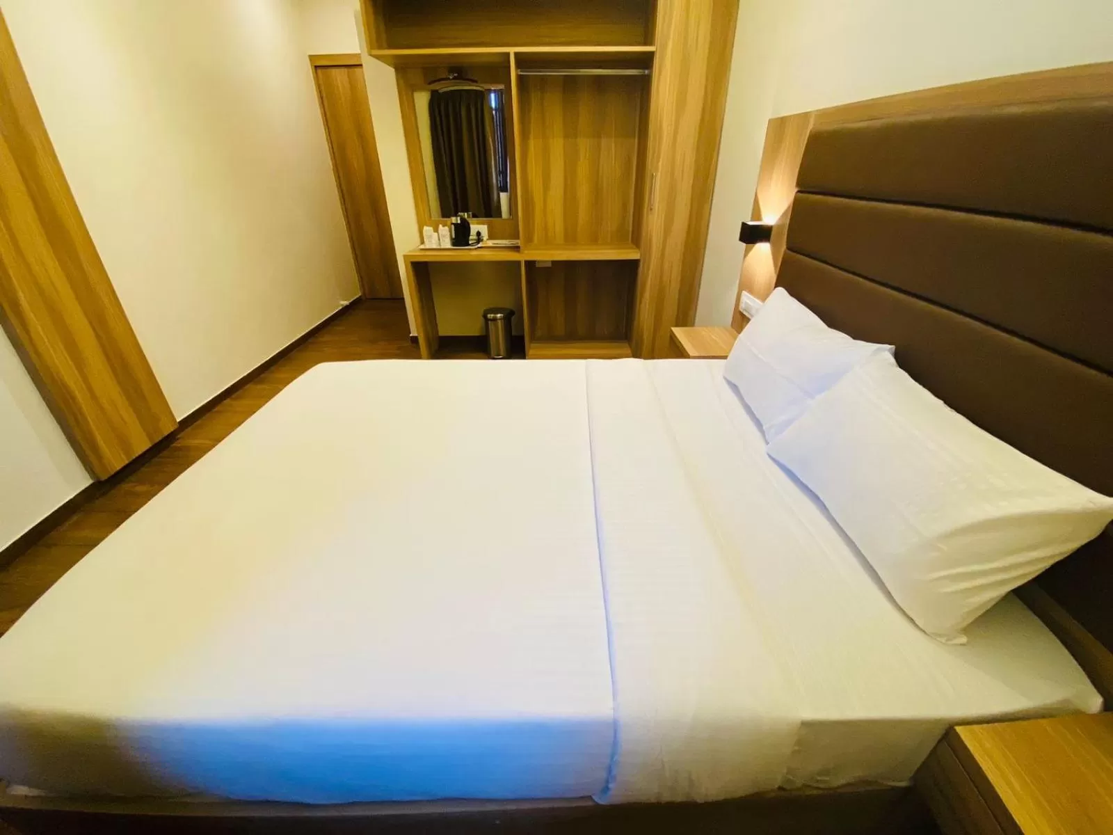 Bed in Hotel Plaza Heights by RAK Rooms, Mangaluru