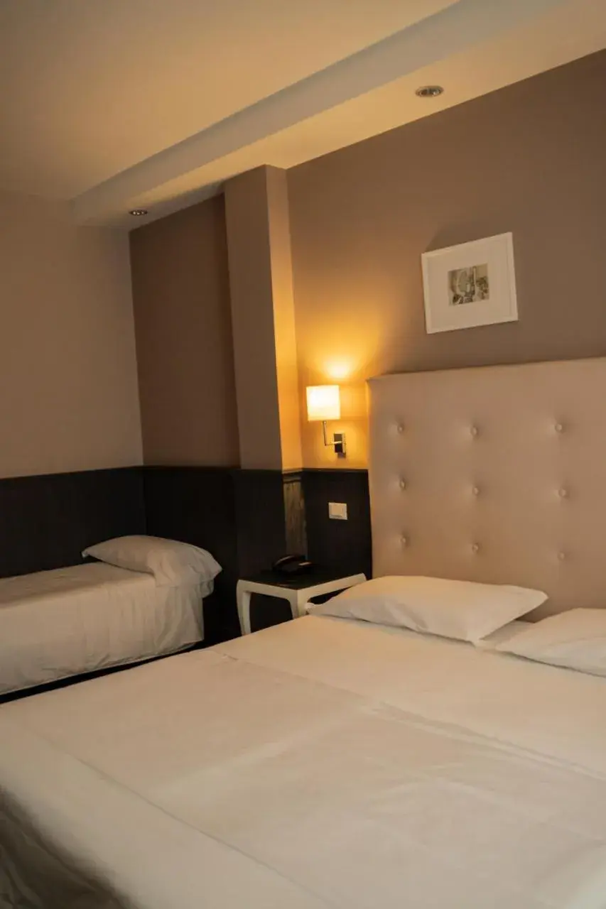 Bed in Hotel Mediterraneo