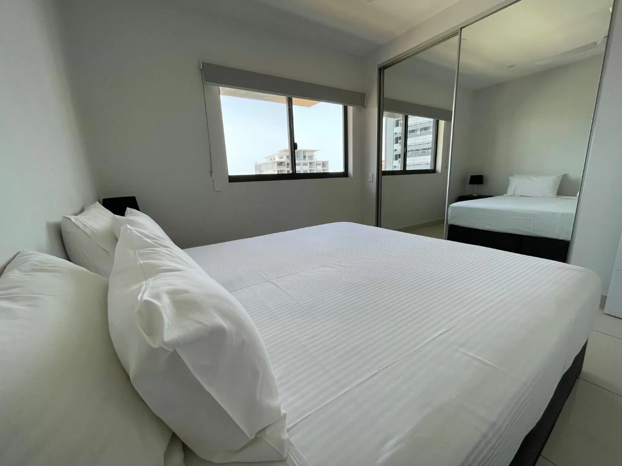 Bed in Magnum Serviced Apartments