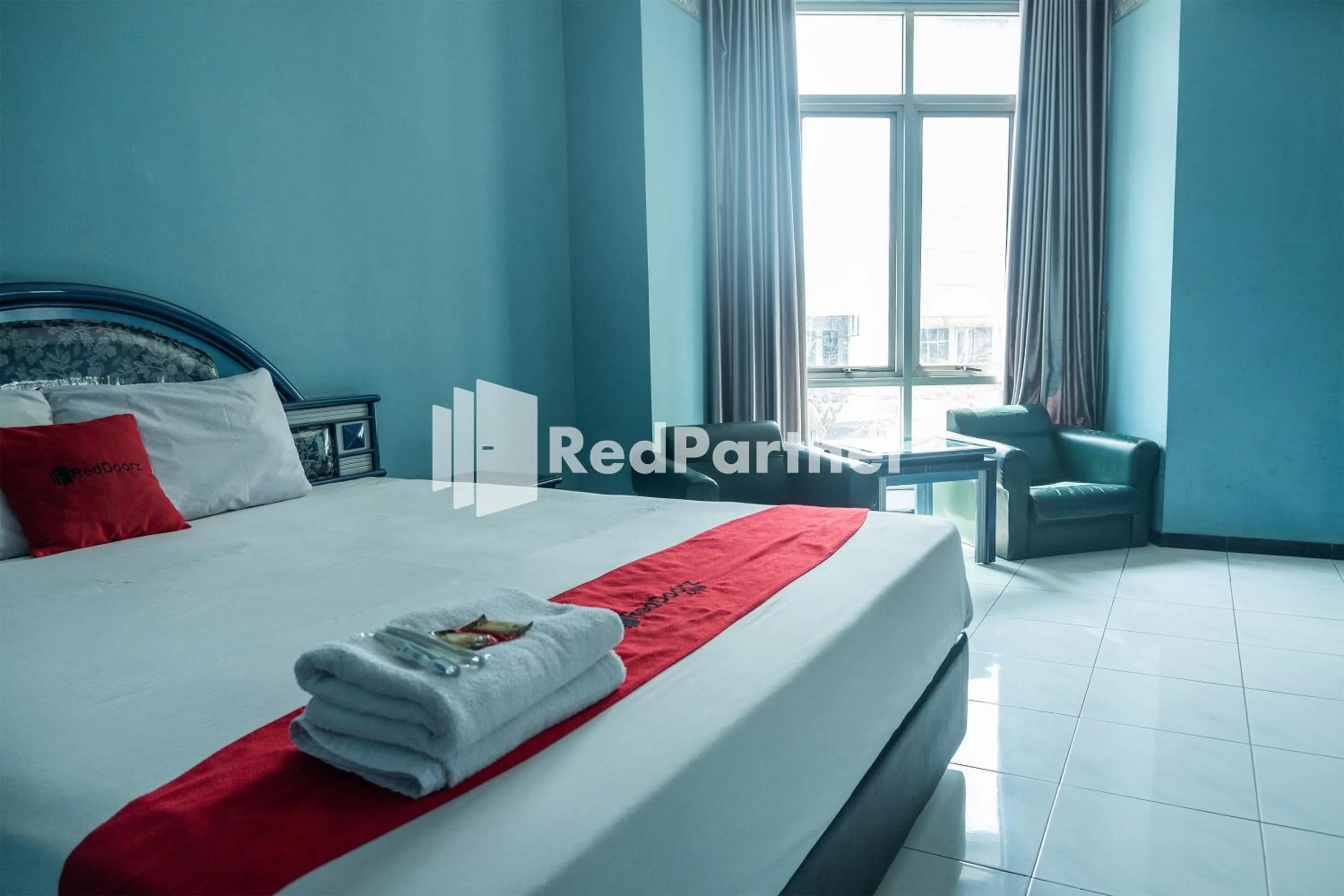 Bed in Akur Hotel Malioboro Mitra RedDoorz