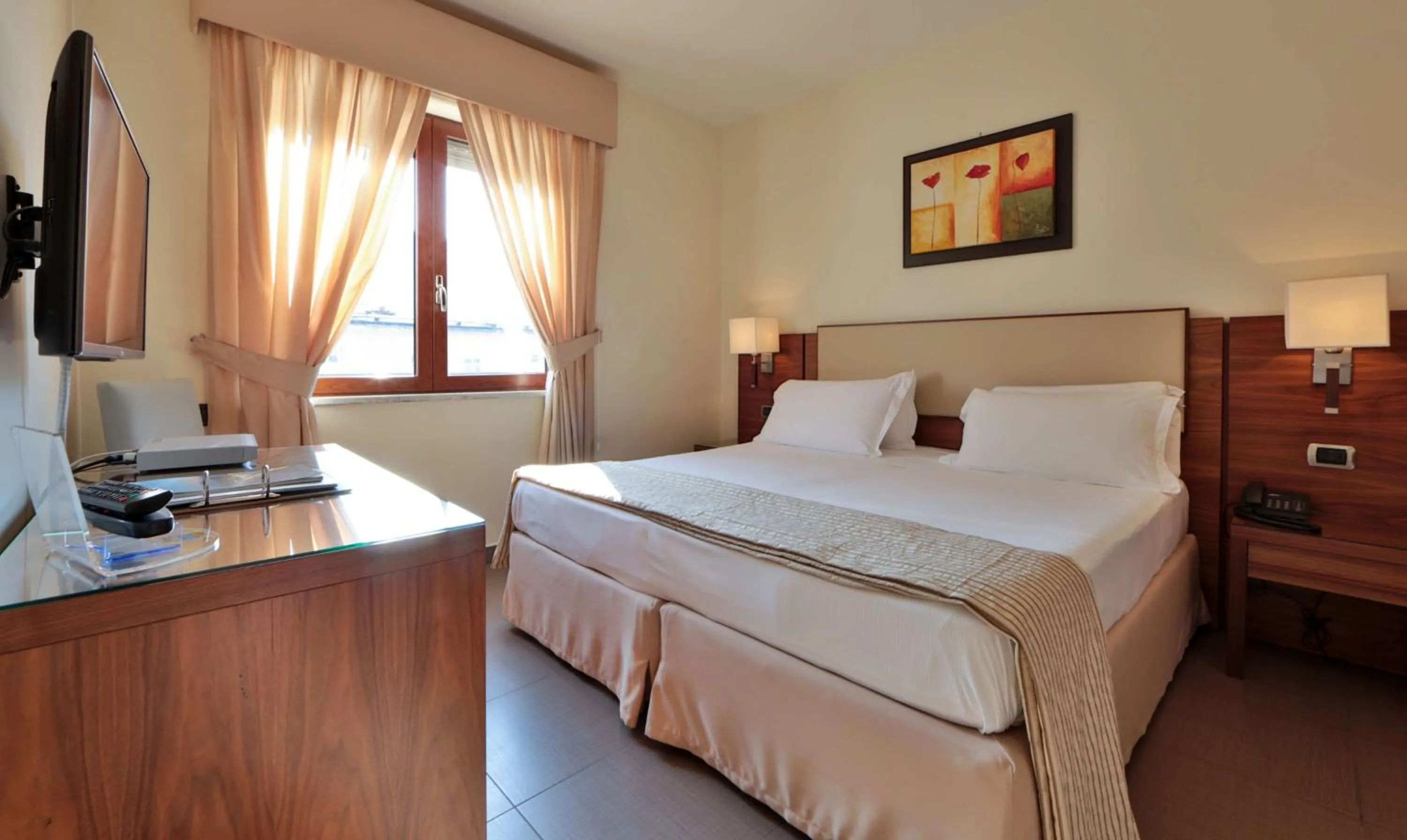 Bed in Suites & Residence Hotel