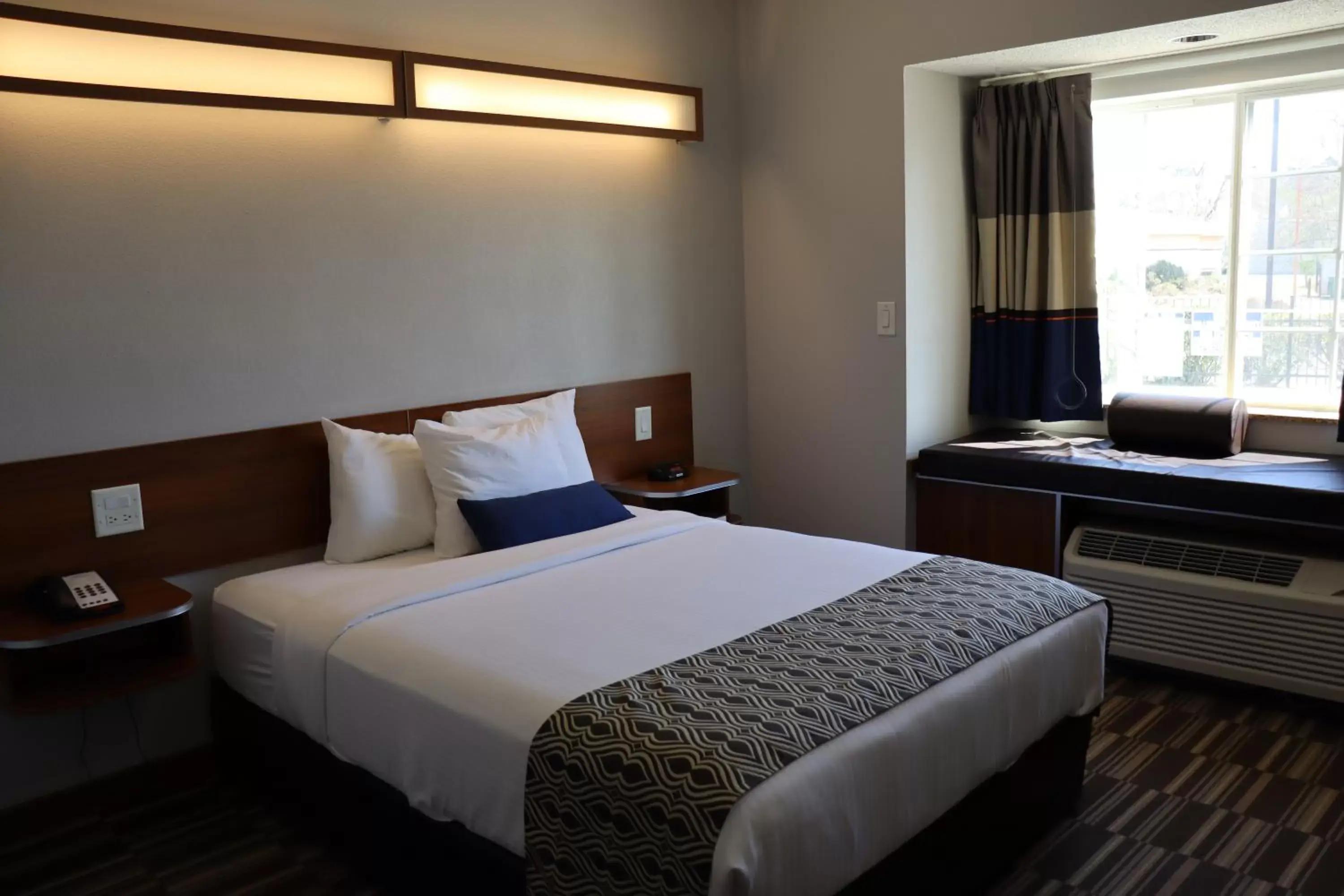 Bed in Microtel Inn & Suites by Wyndham Columbus Near Fort Moore