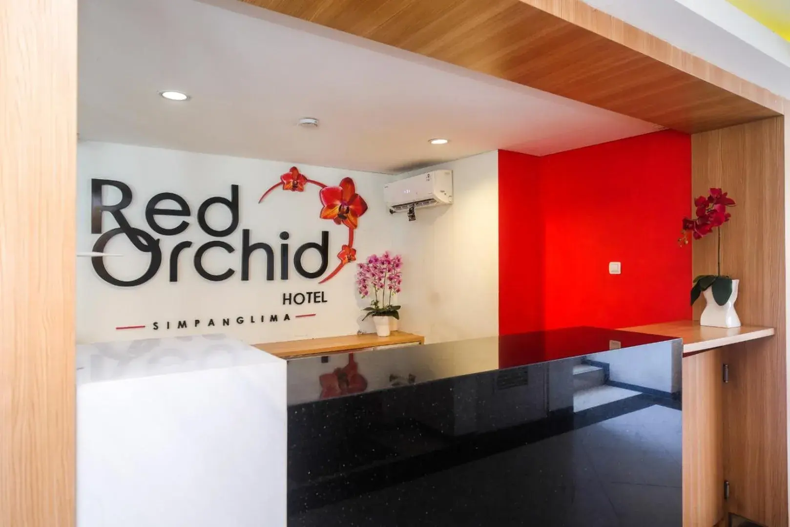 Lobby or reception in Red Orchid Hotel