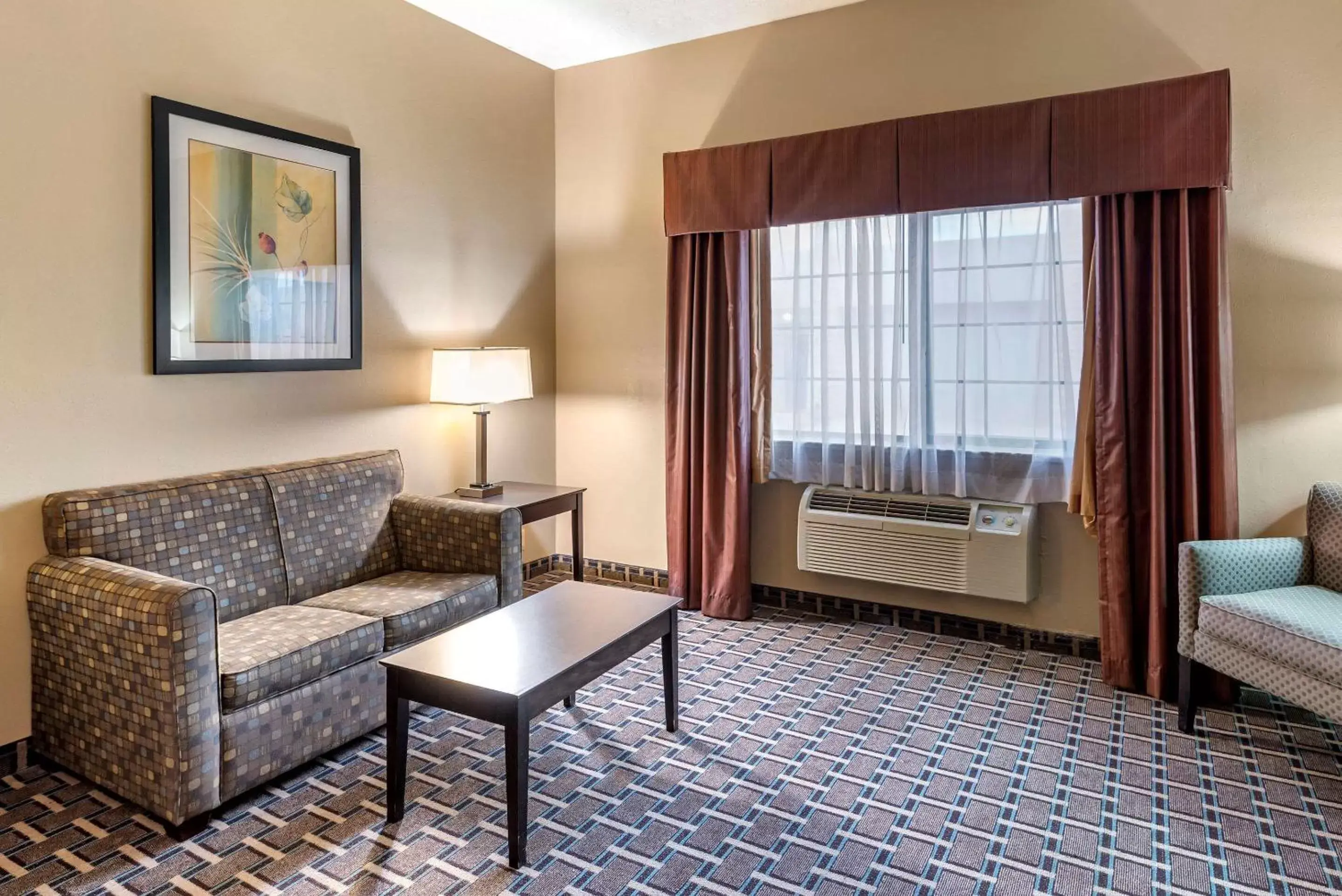 Bedroom, Seating Area in Comfort Suites