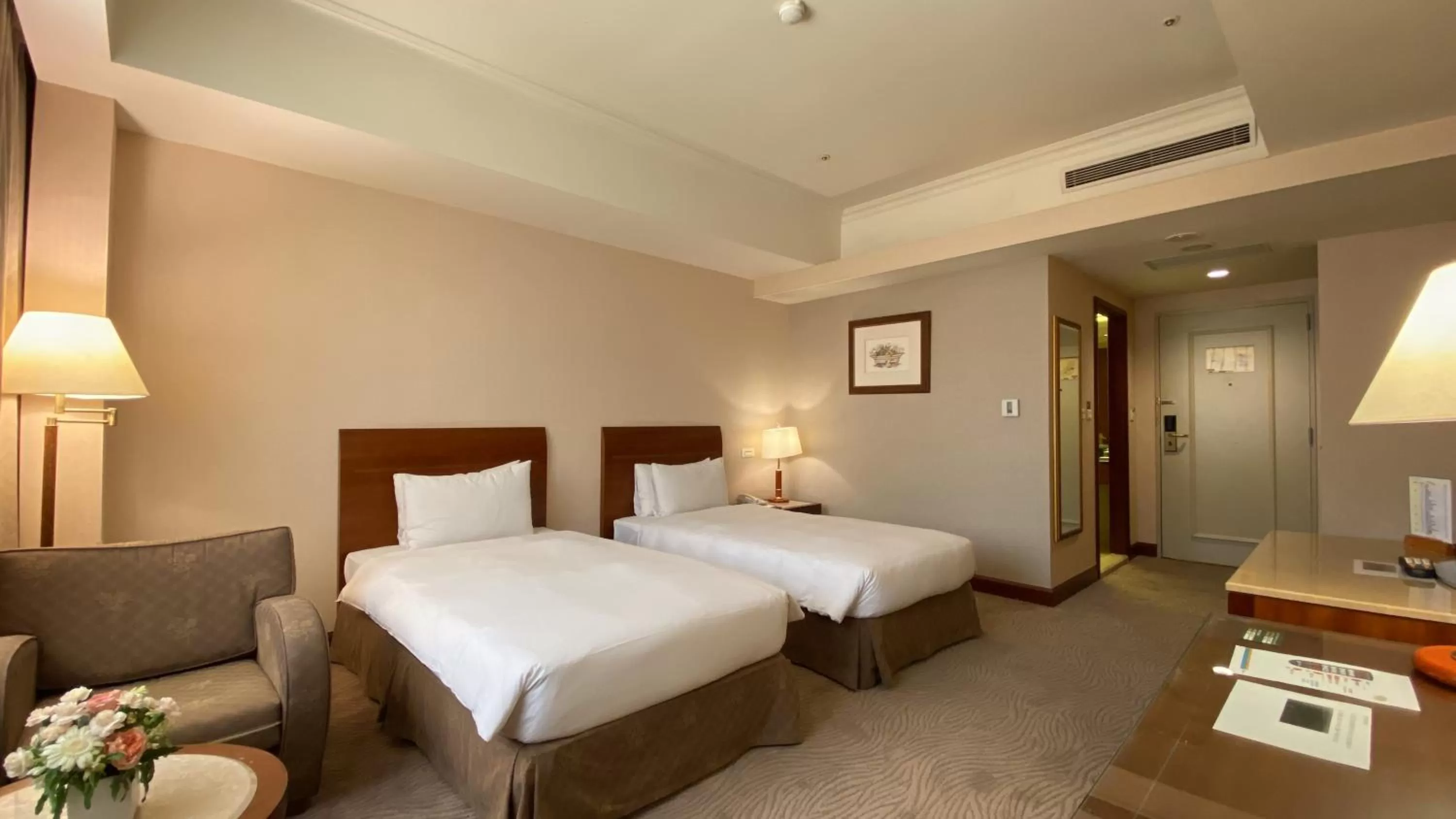 Bed in Monarch Plaza Hotel