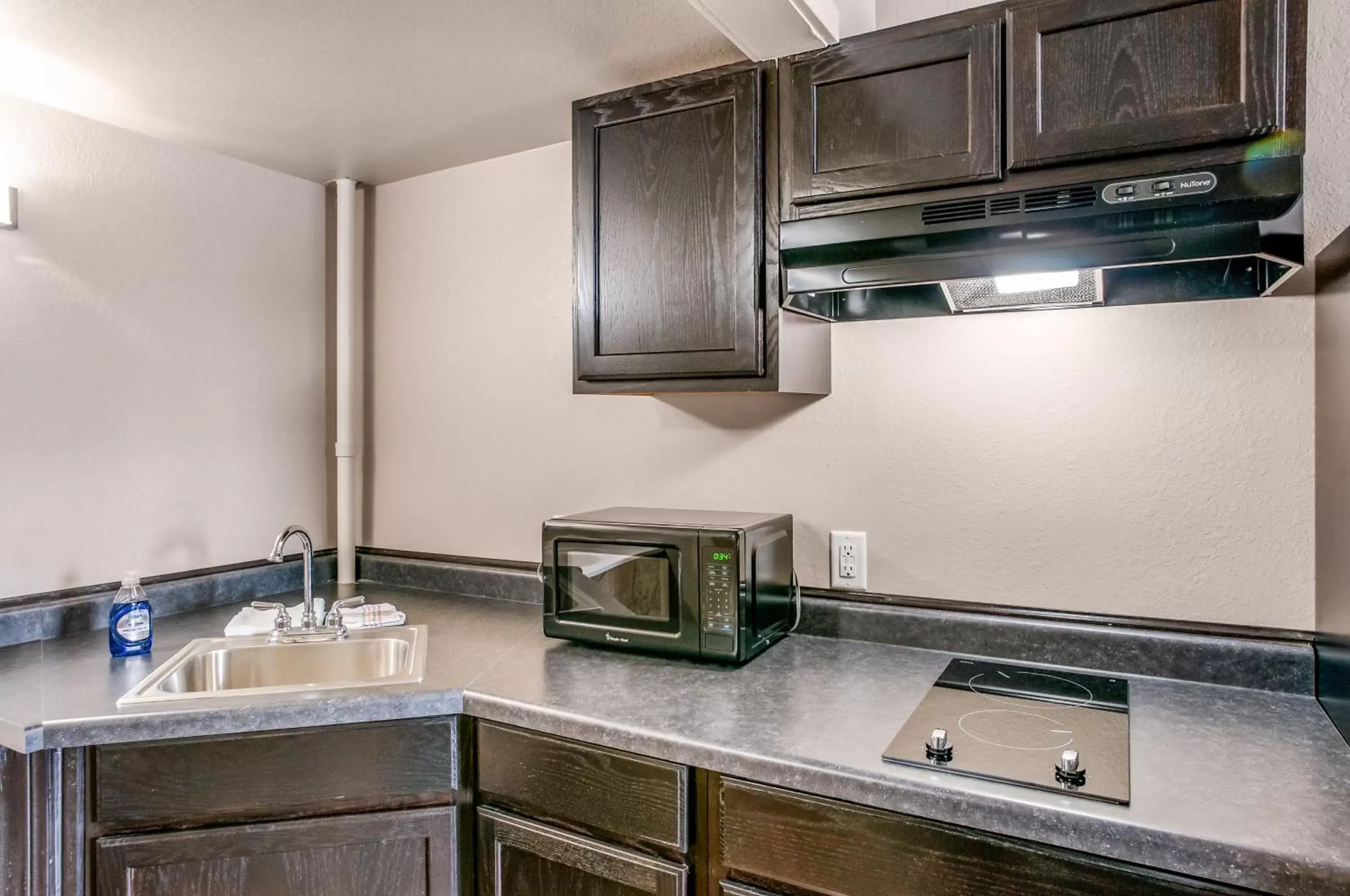 Kitchen or kitchenette, Kitchen/Kitchenette in Suburban Studios Neenah