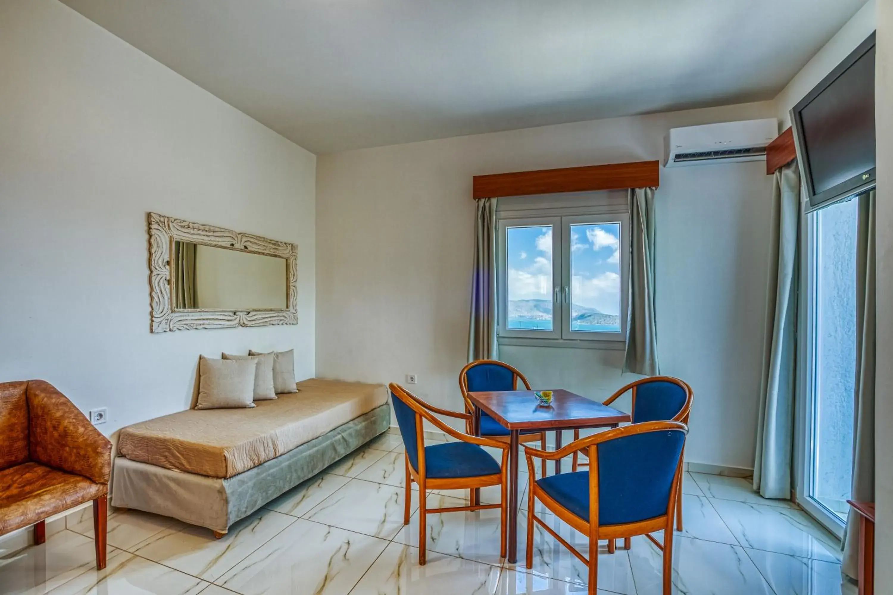 Bed, Seating Area in Elounda Water Park Residence Hotel