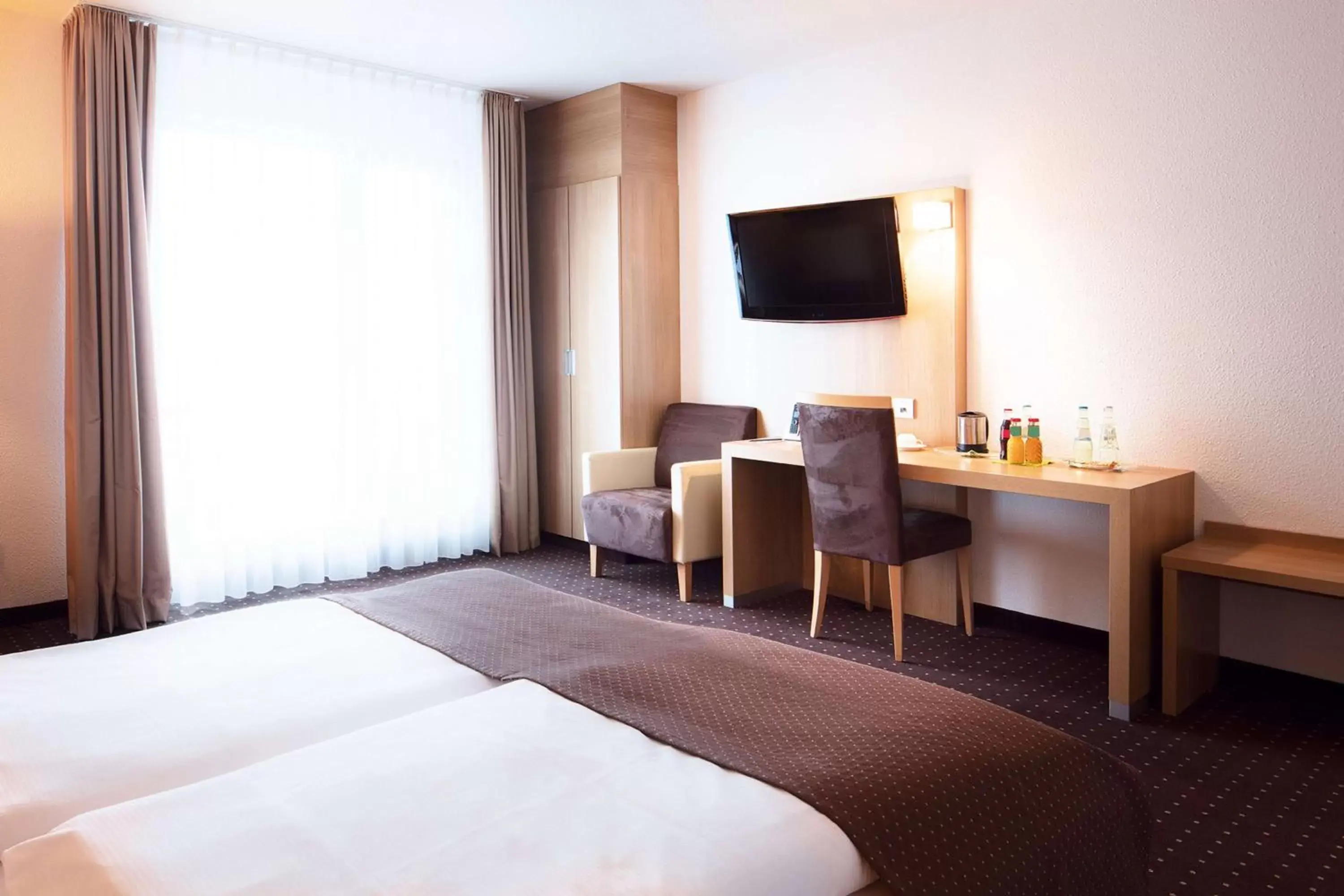 Photo of the whole room, TV/Entertainment Center in Lanzcarré Hotel Mannheim, a member of Radisson Individuals