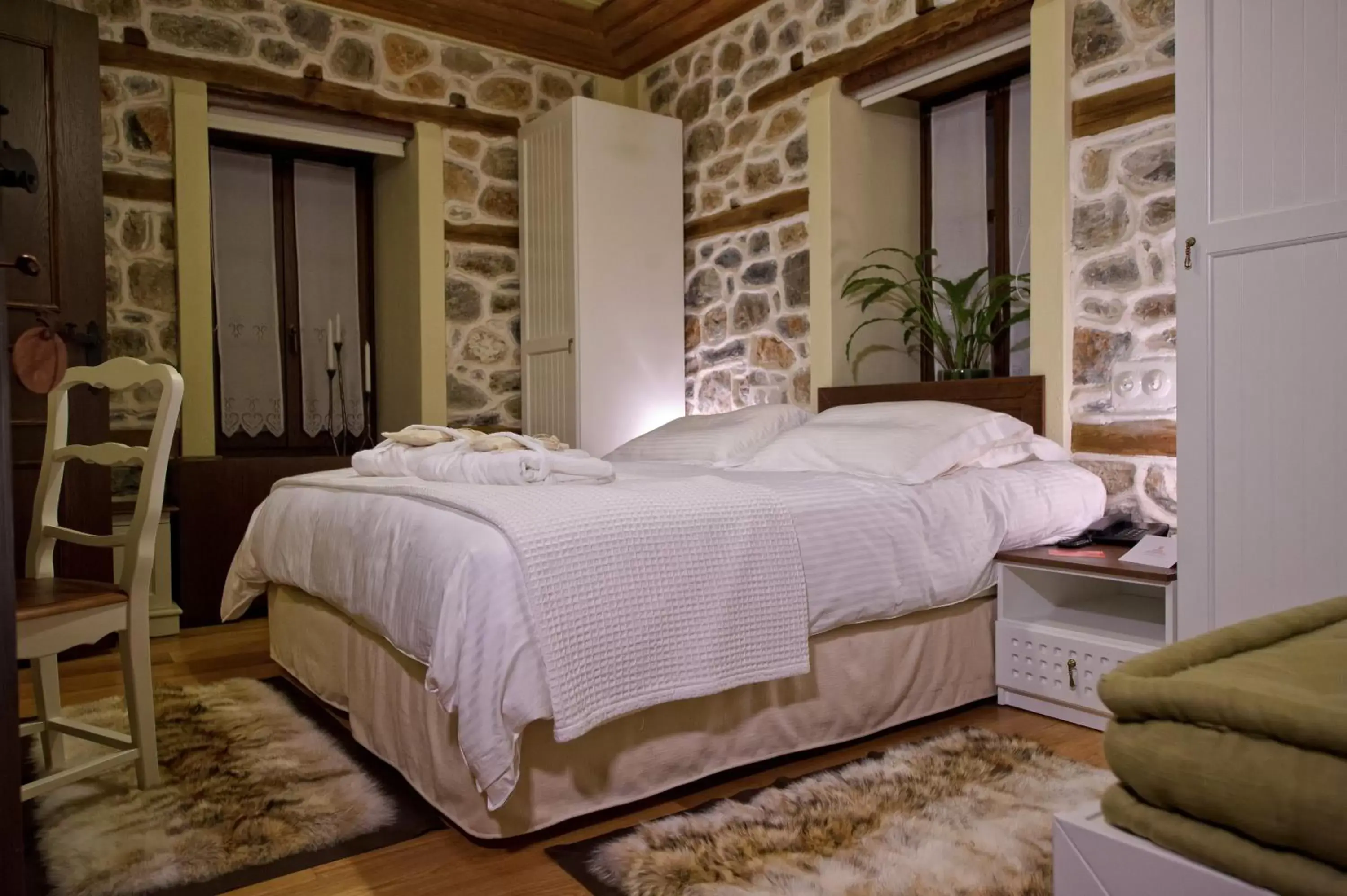 Bed in Orologopoulos Mansion Luxury Hotel