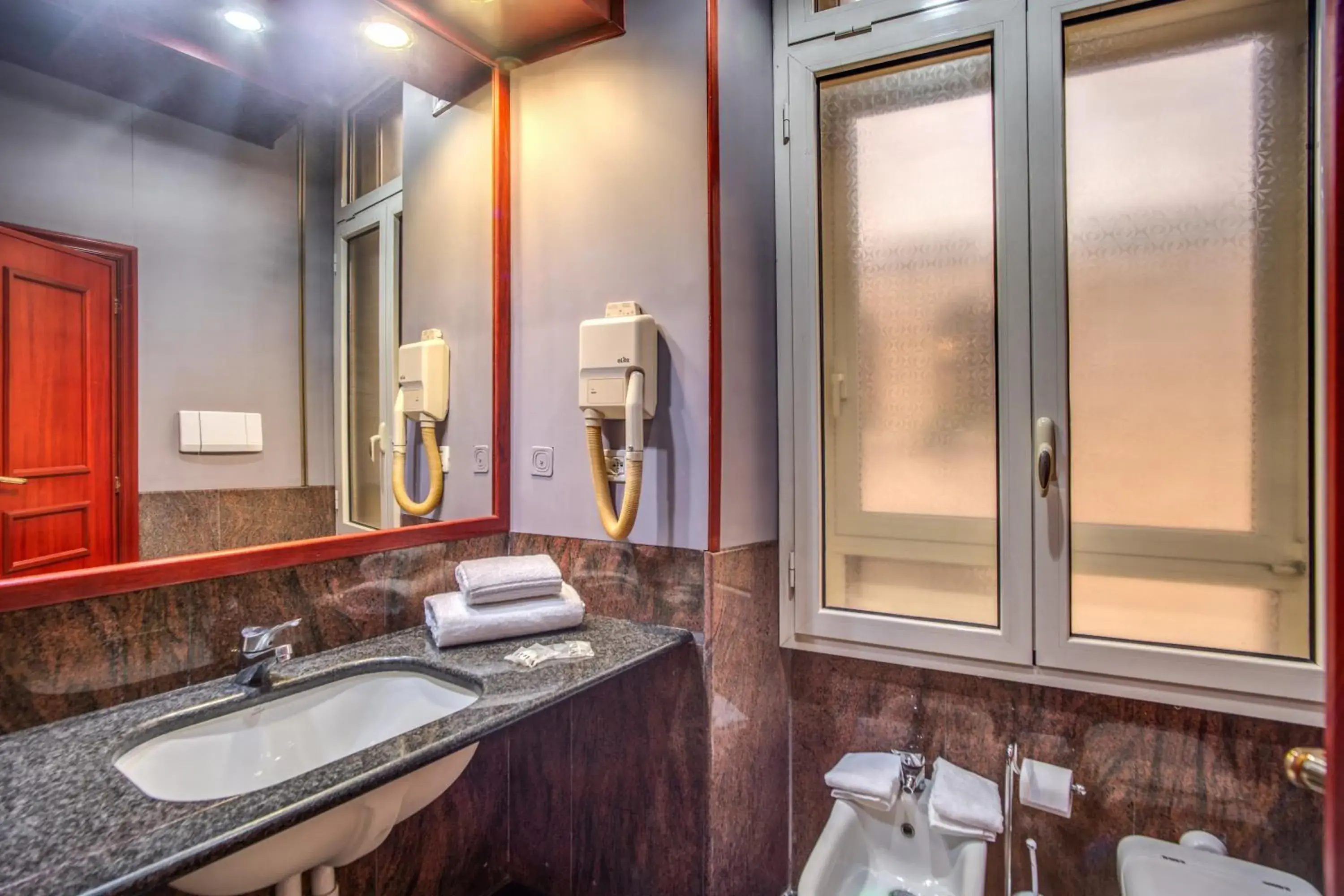 Toilet, Bathroom in Madison Hotel