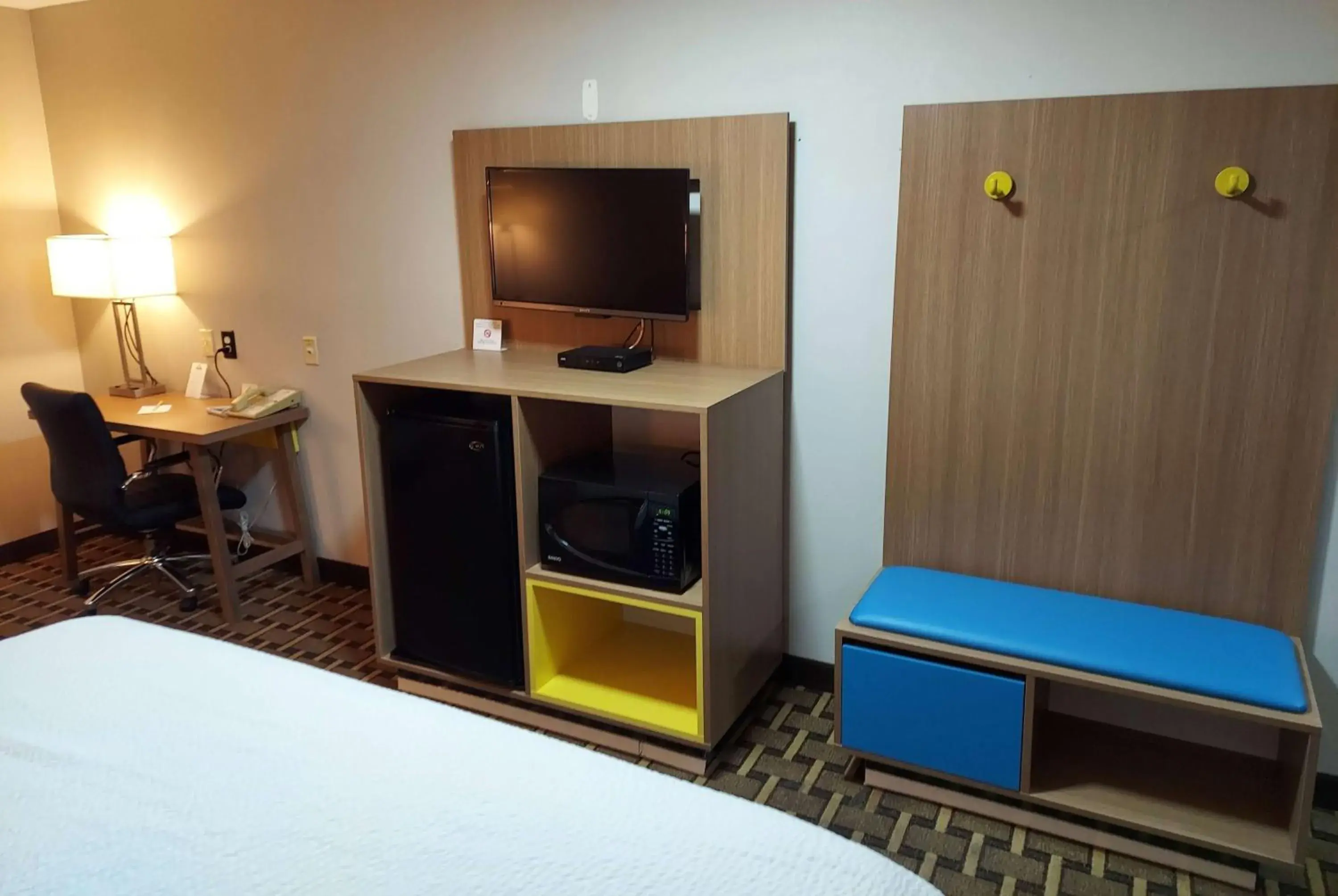 Photo of the whole room, TV/Entertainment Center in Days Inn & Suites by Wyndham Huntsville