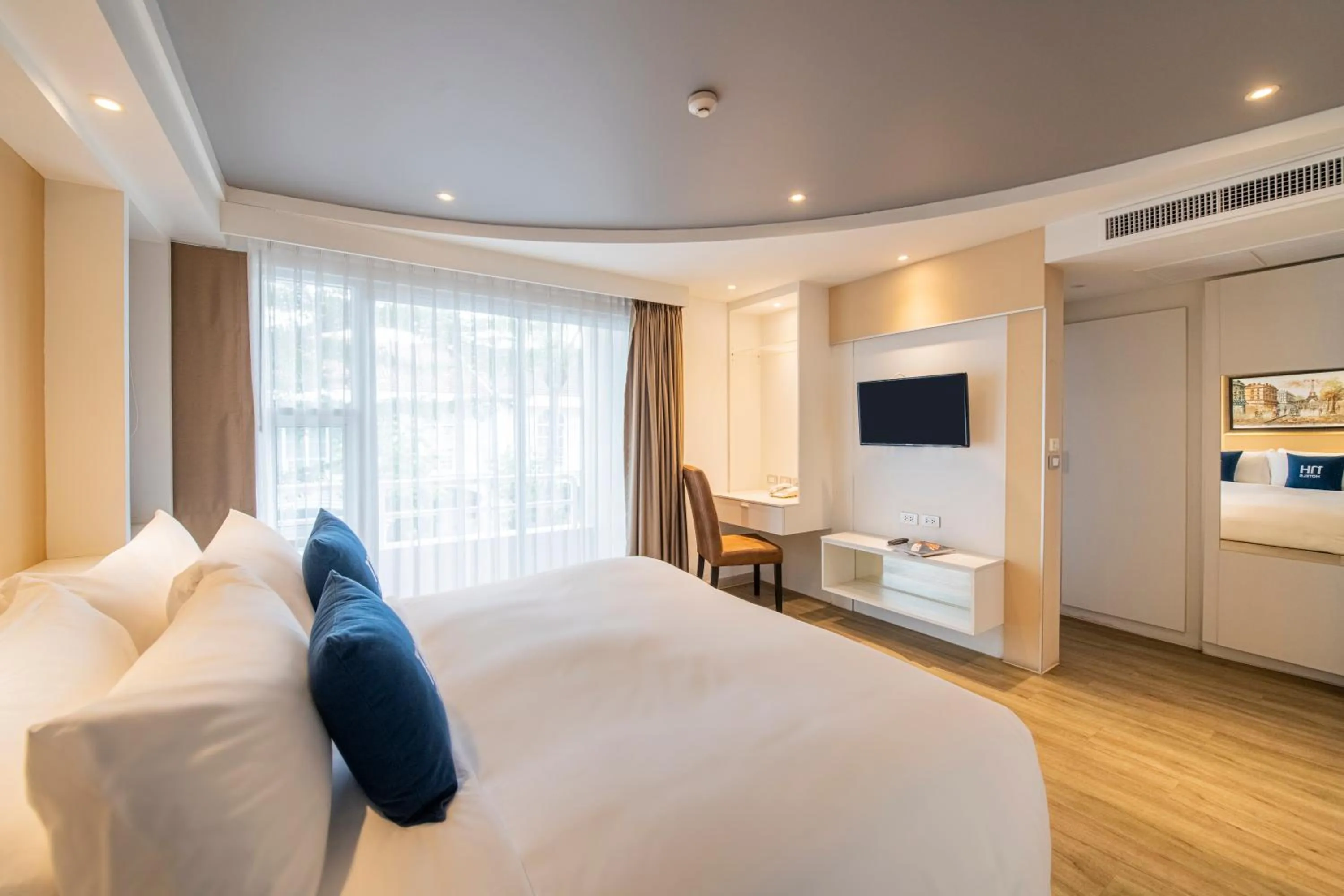 Bed in NH Boat Lagoon Phuket Resort