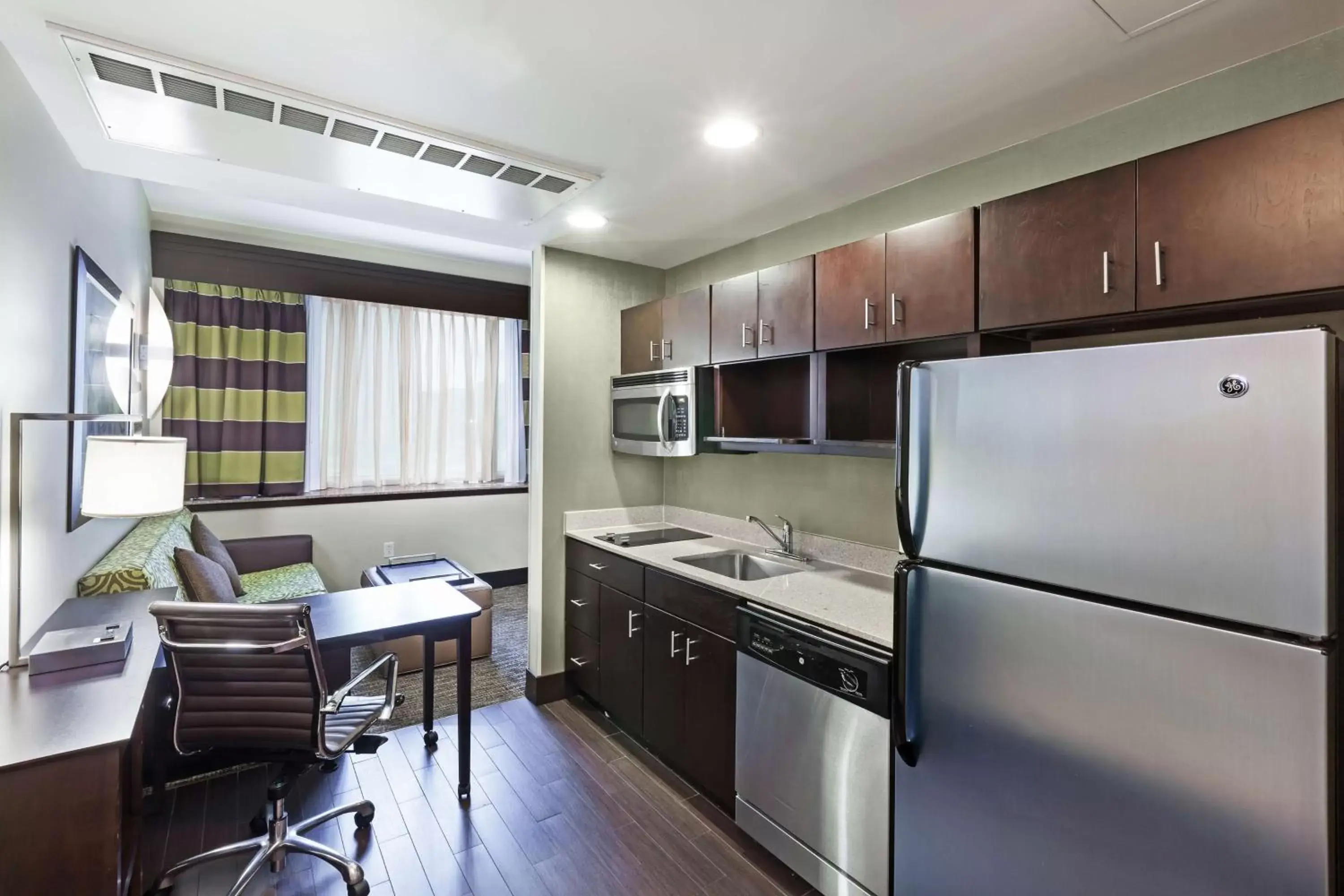 Bedroom, Kitchen/Kitchenette in Homewood Suites Dallas Downtown