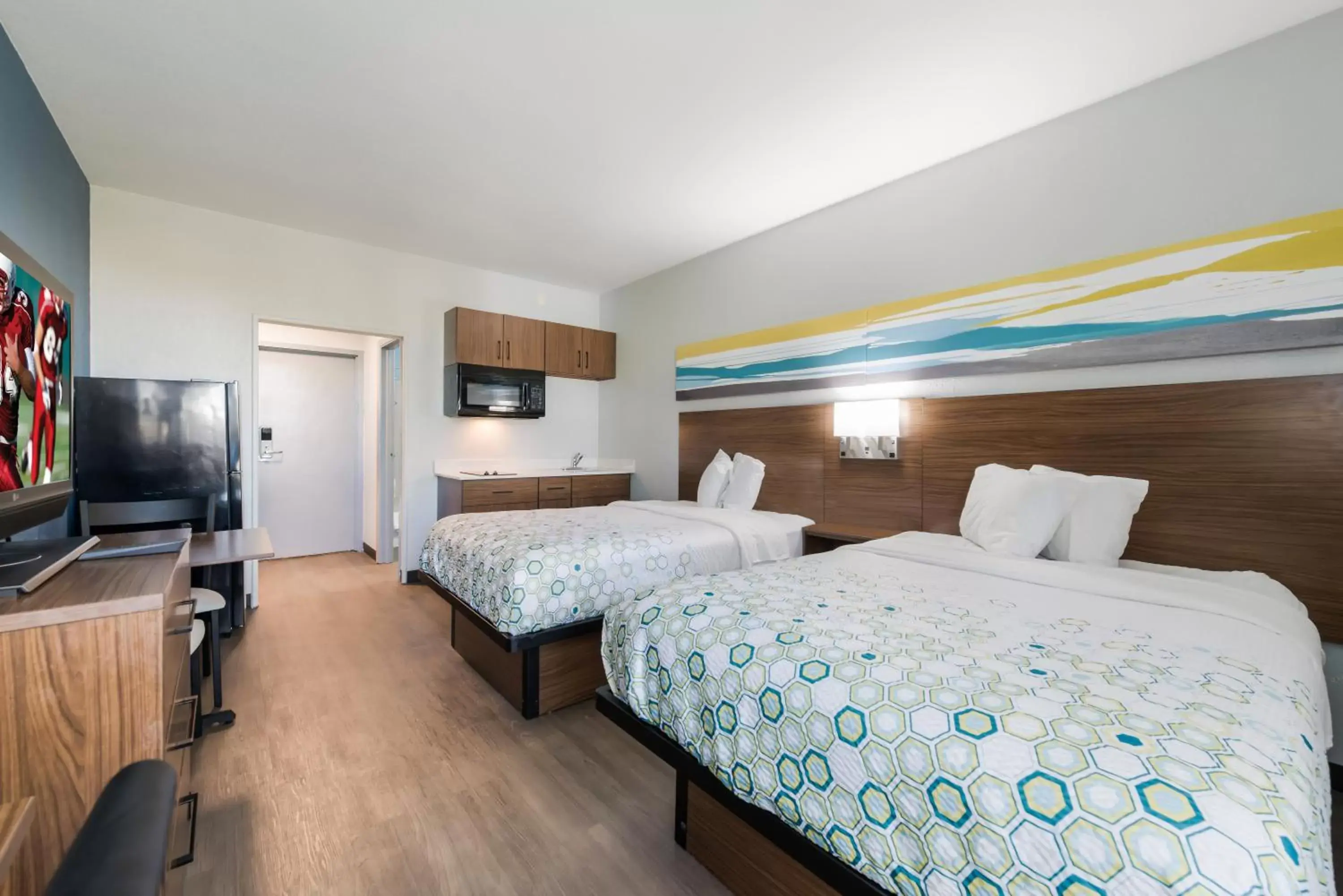 Bedroom, Bed in HomeTowne Studios by Red Roof Newport News - Hampton West Bedroom, Bed in HomeTowne Studios by Red Roof Newport News - Hampton West