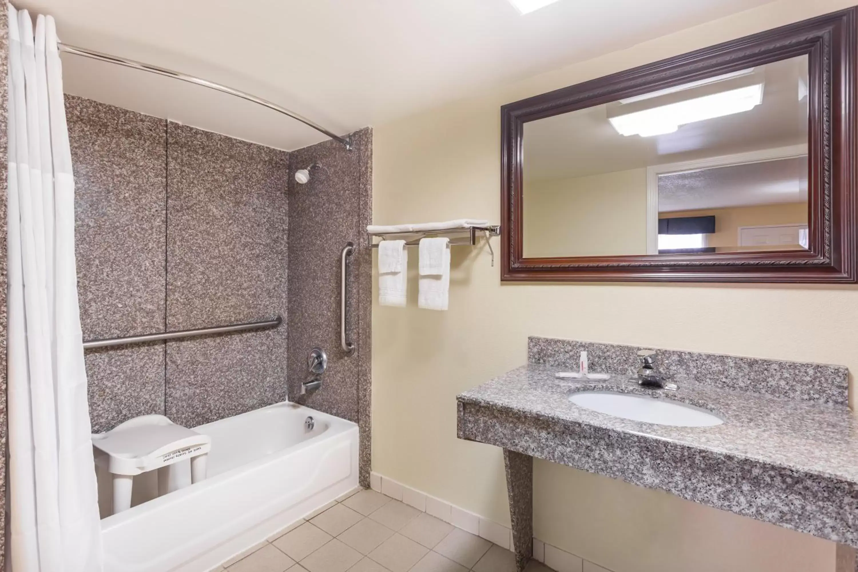 Property building, Bathroom in Days Inn & Suites by Wyndham Warner Robins Near Robins AFB