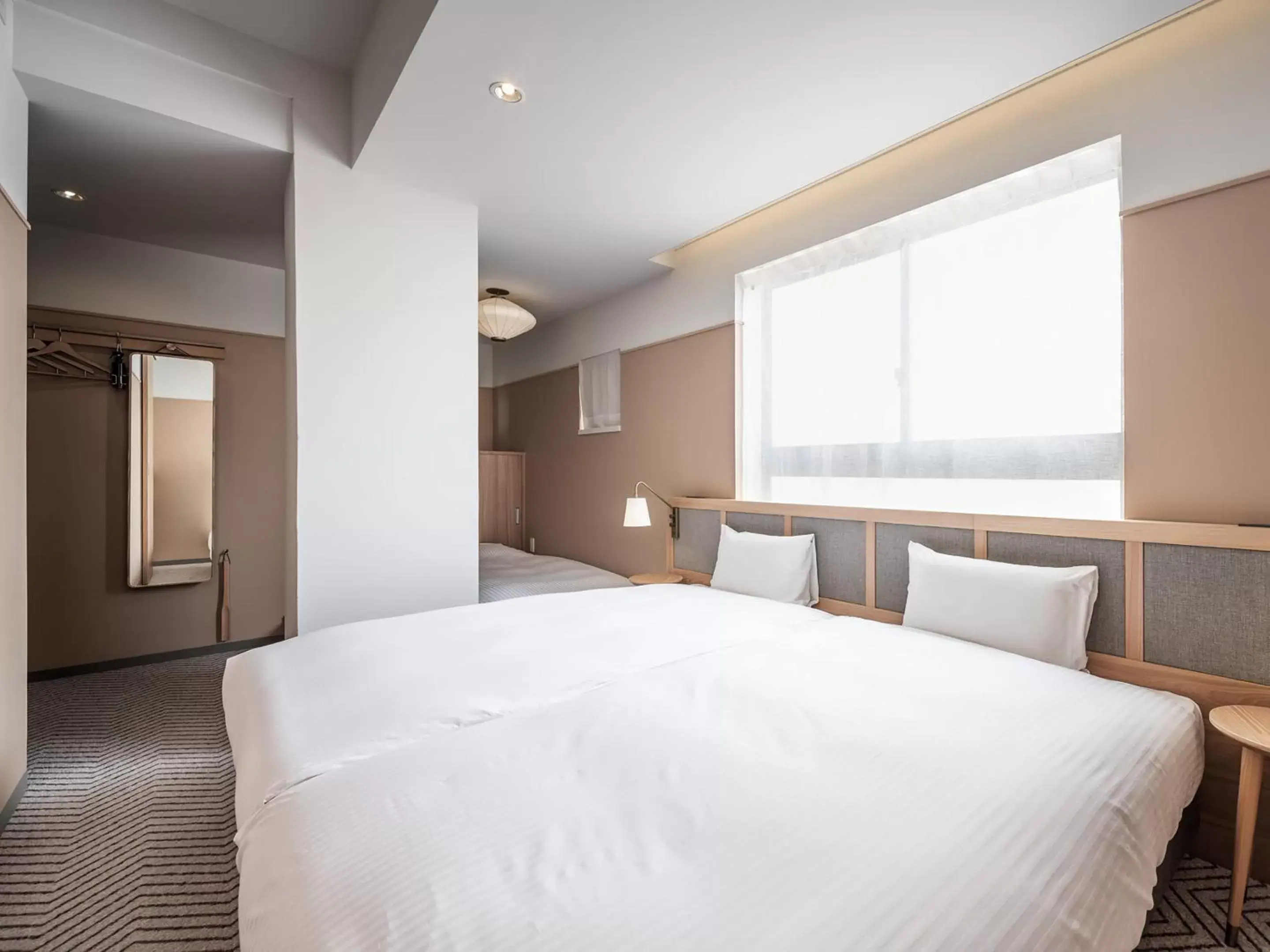 Photo of the whole room, Bed in RAKURO Kyoto by THE SHARE HOTELS