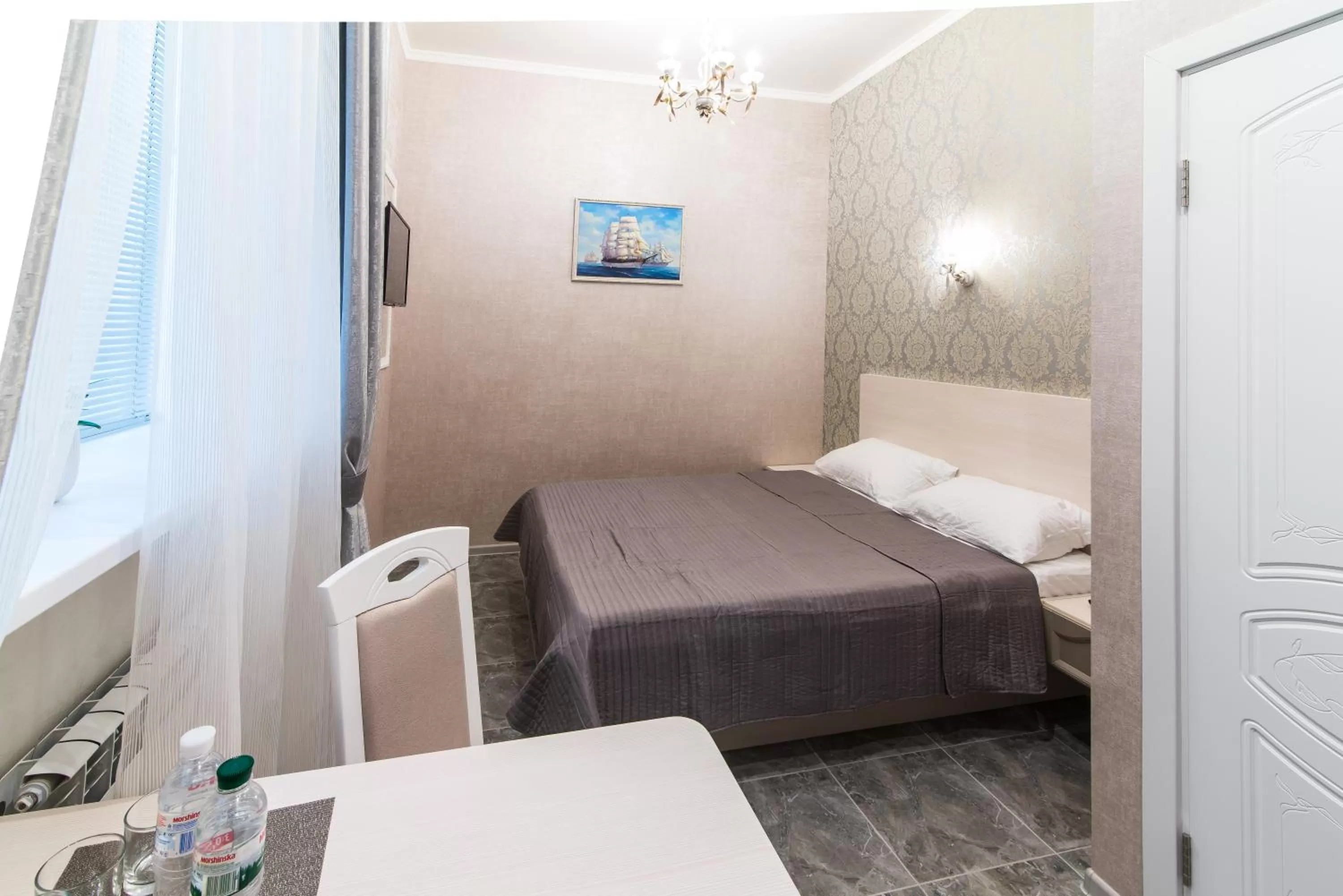 Bed in L.O.Y Family Hotel