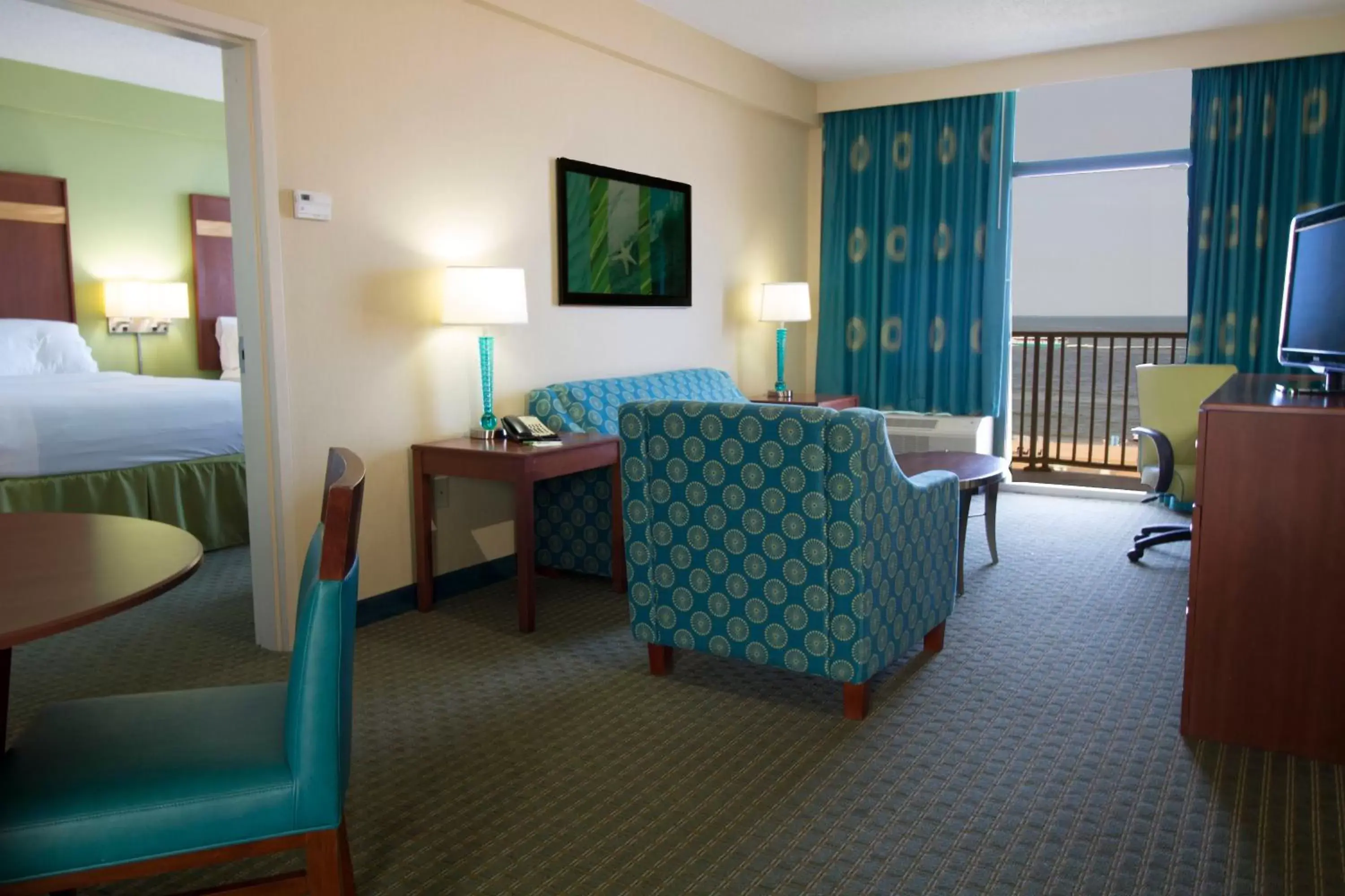 Photo of the whole room, Seating Area in Holiday Inn & Suites Virginia Beach - North Beach, an IHG Hotel