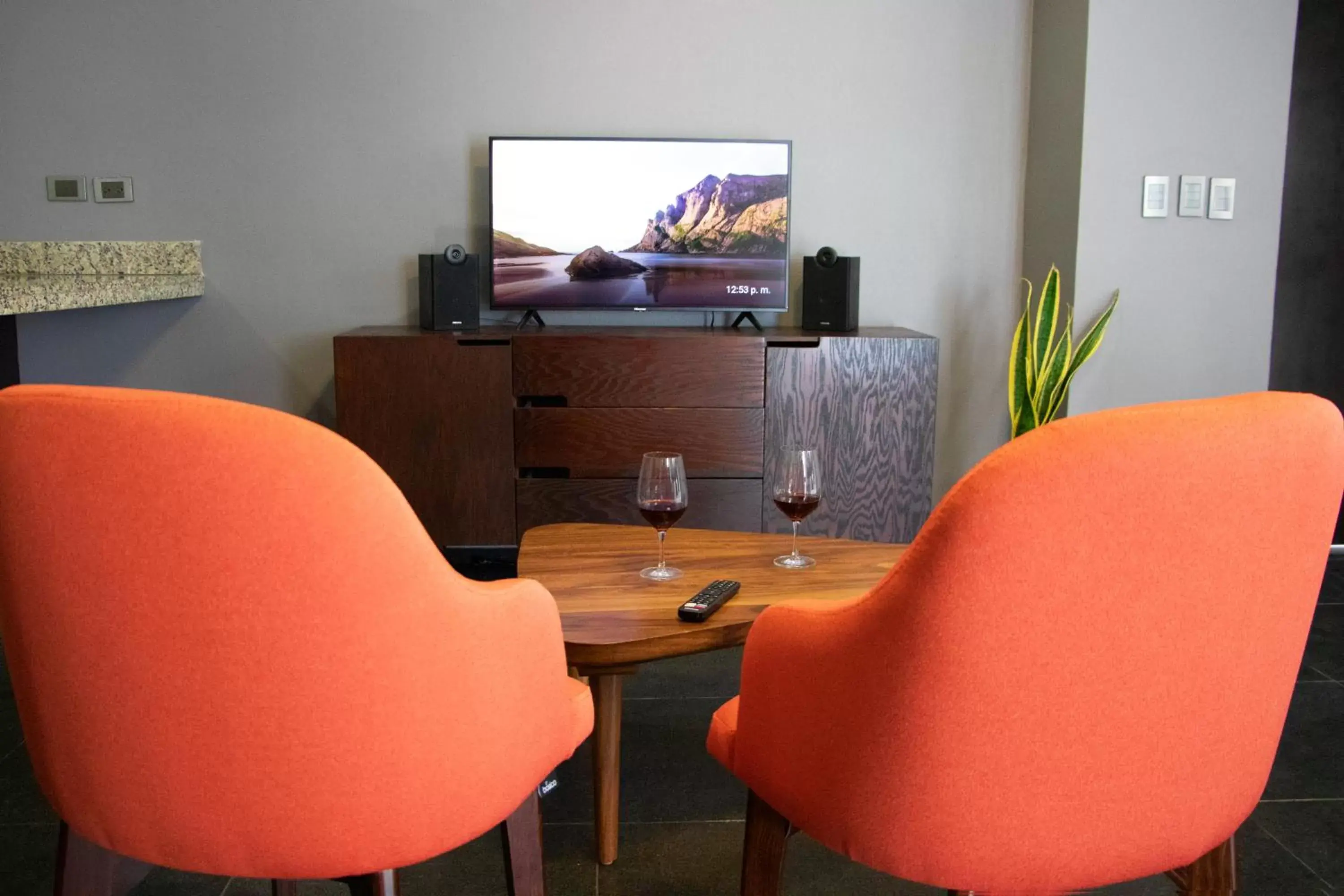 Living room, TV/Entertainment Center in Sole Suites