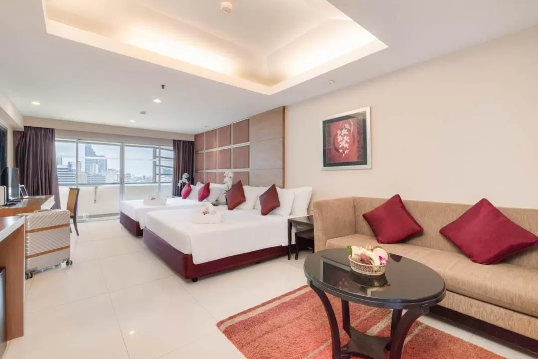 Living room, Bed in Furama Silom Hotel