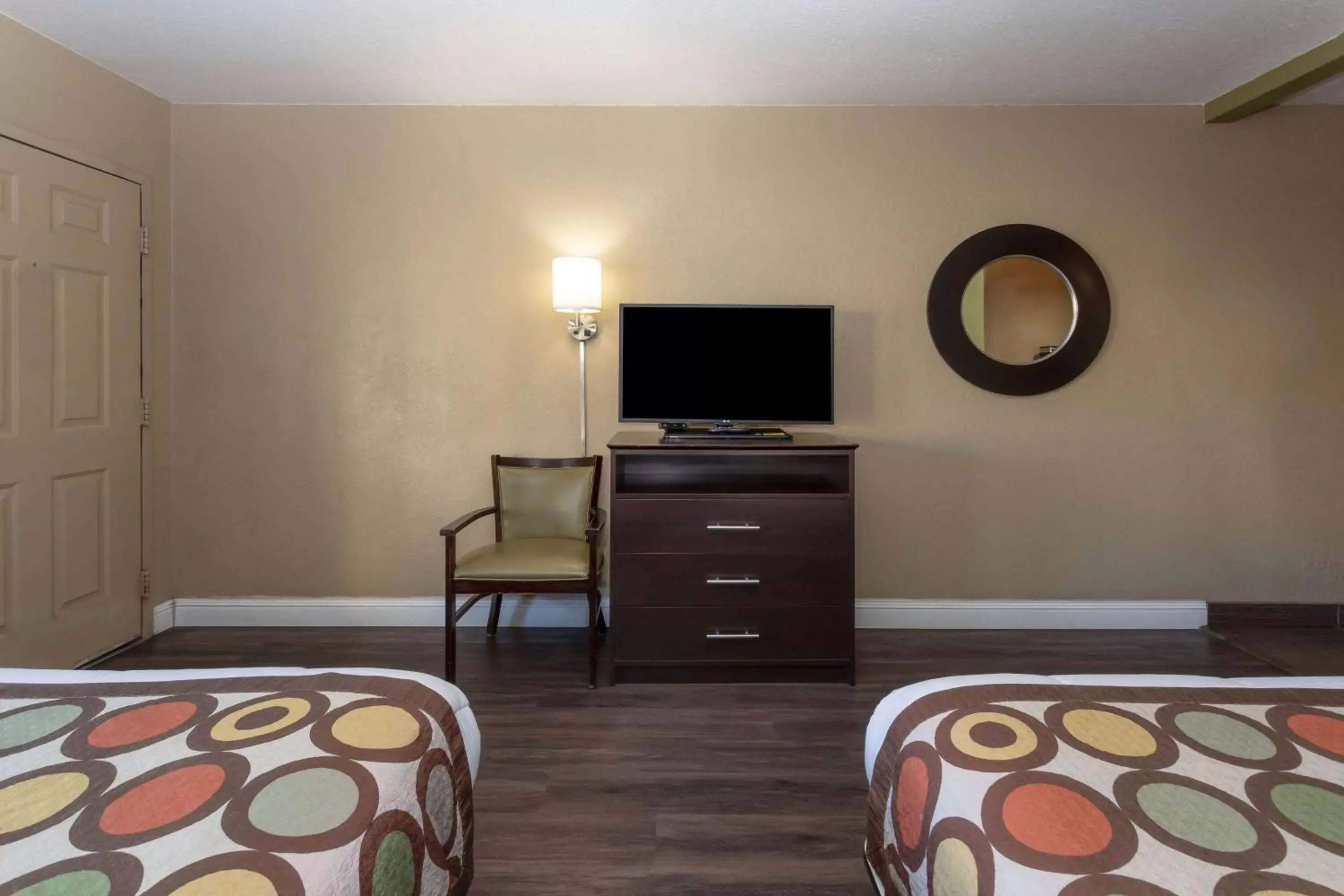 Photo of the whole room, TV/Entertainment Center in Super 8 by Wyndham NAU/Downtown Conference Center