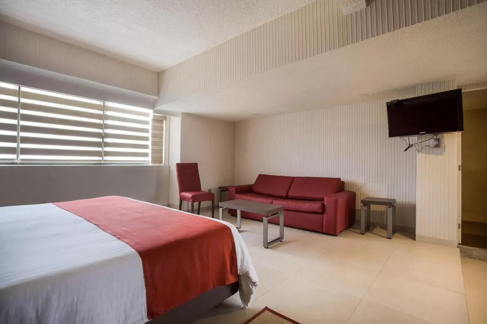 Living room, Bed in Hotel Puente Real Living room, Bed in Hotel Puente Real