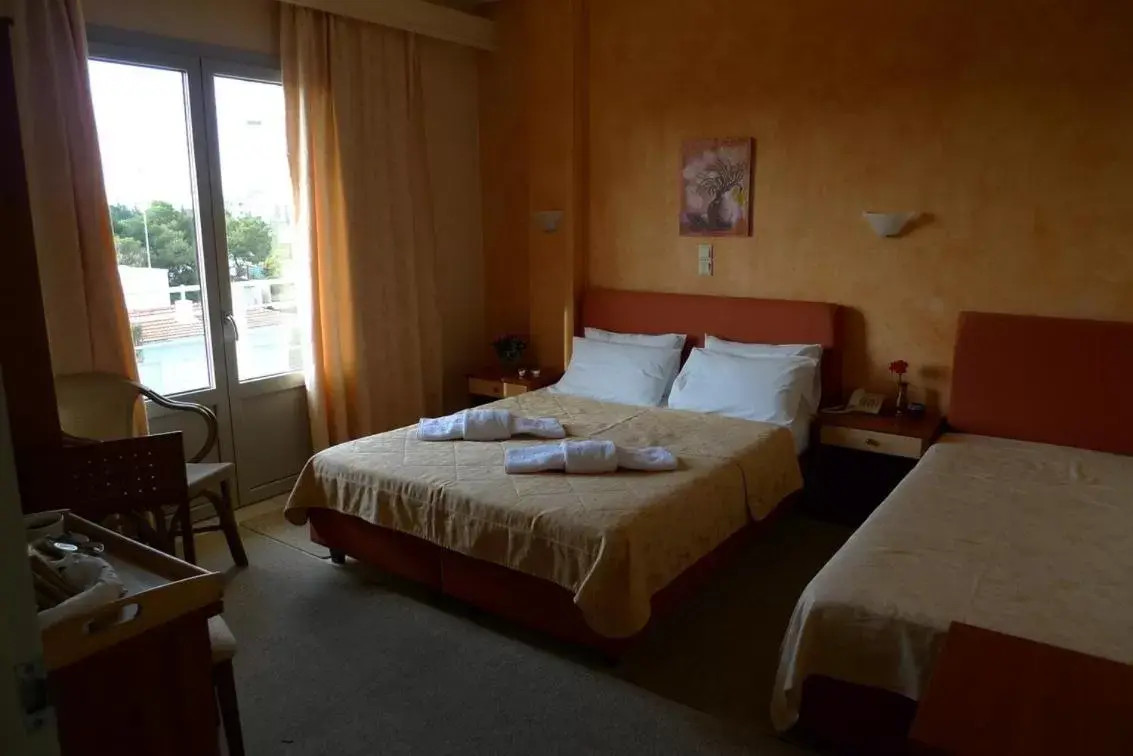 Bed in IKAROS Hotel